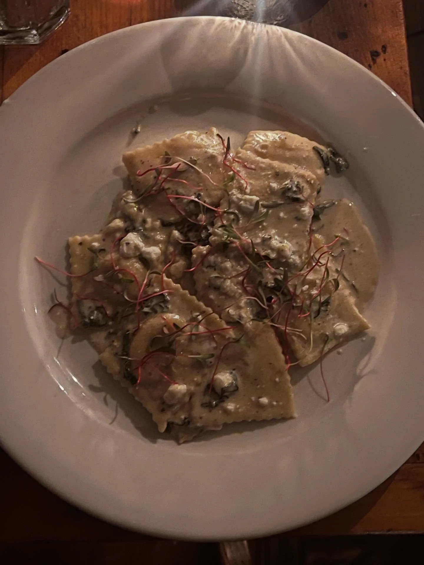 Pumpkin ravioli made in house with a brown butter and sage sauce. Topped with a sprinkle of goat cheese. 
Come in this weekend and give it a try.