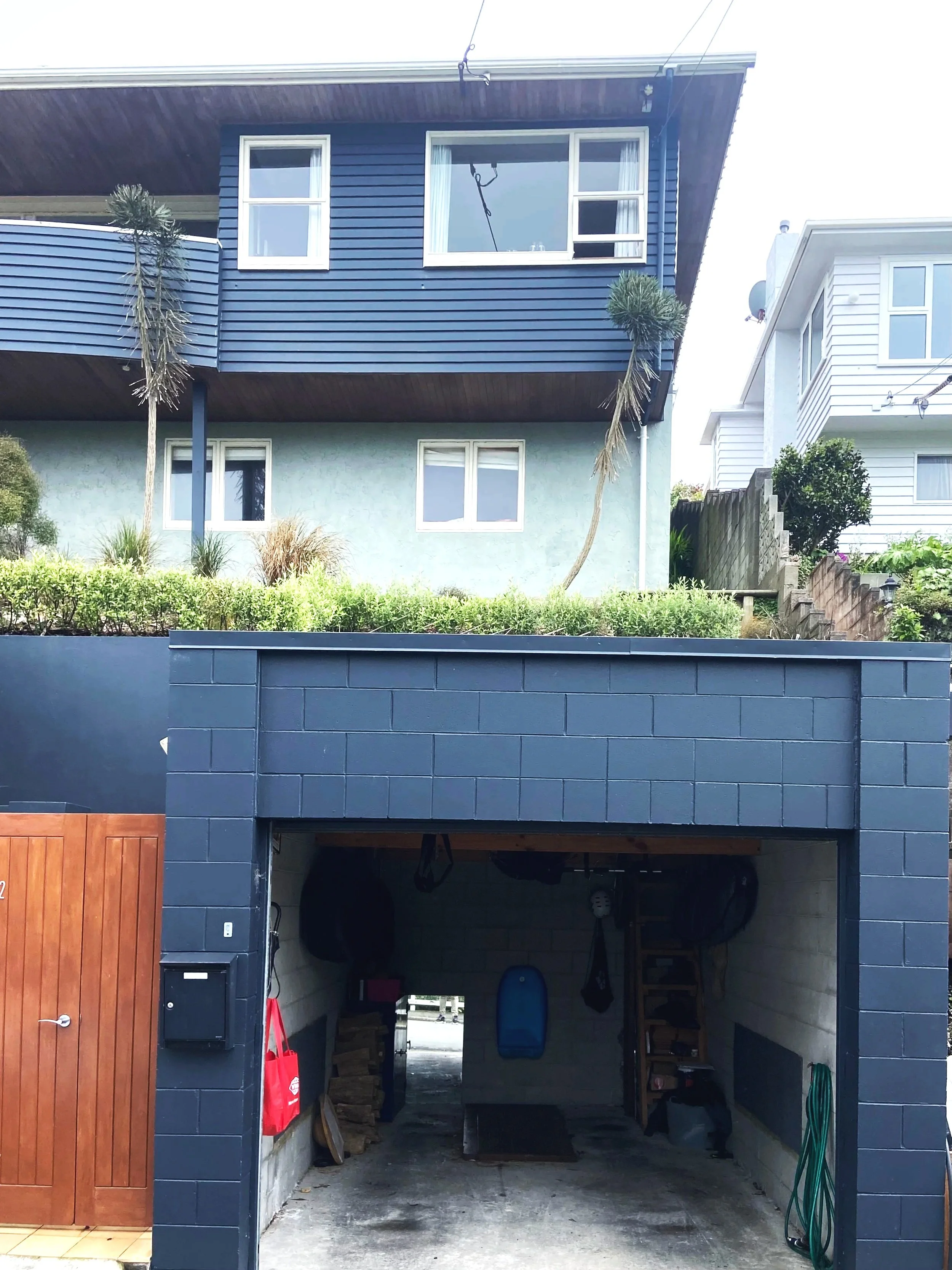 BEFORE - Existing Single Level Garage and Curved Balcony