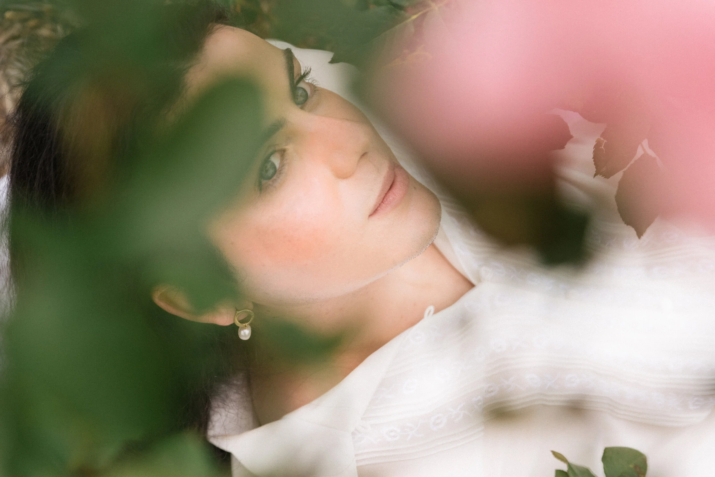 portrait in roses wearing pearls