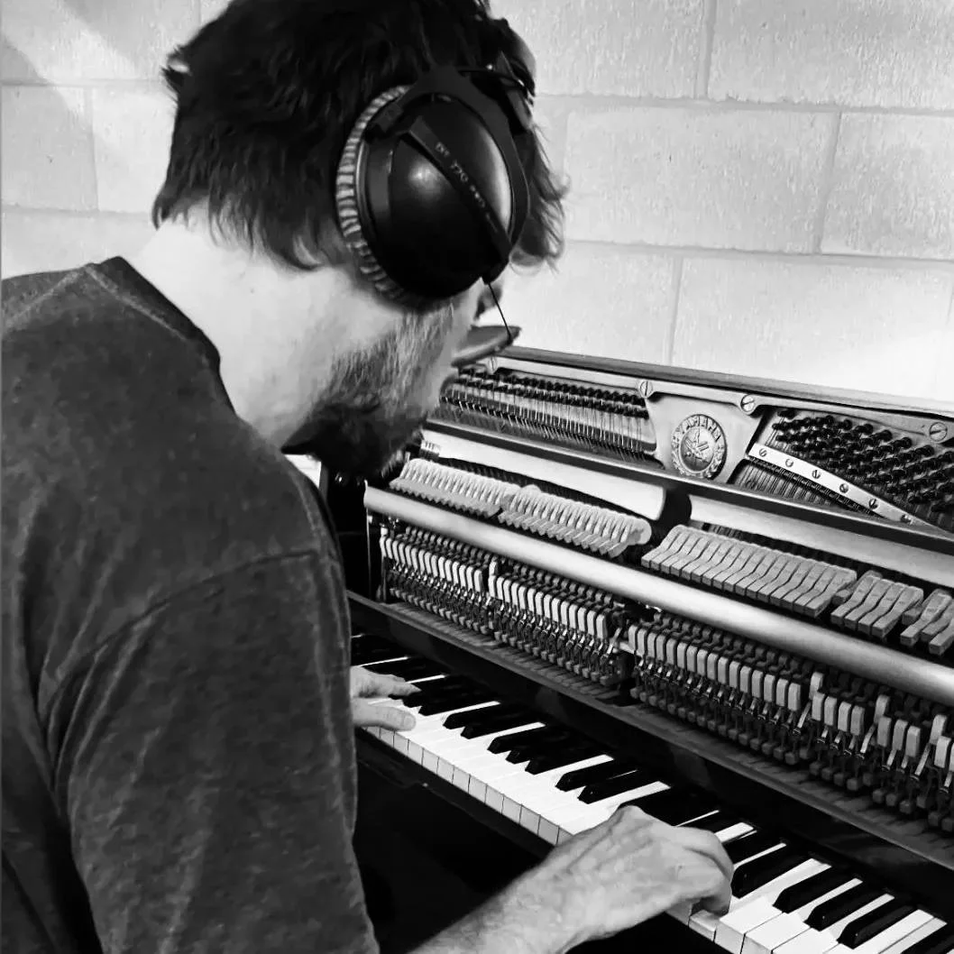 Paul Francis Wood (music producer) recording a man on a piano in his Perth recording studio