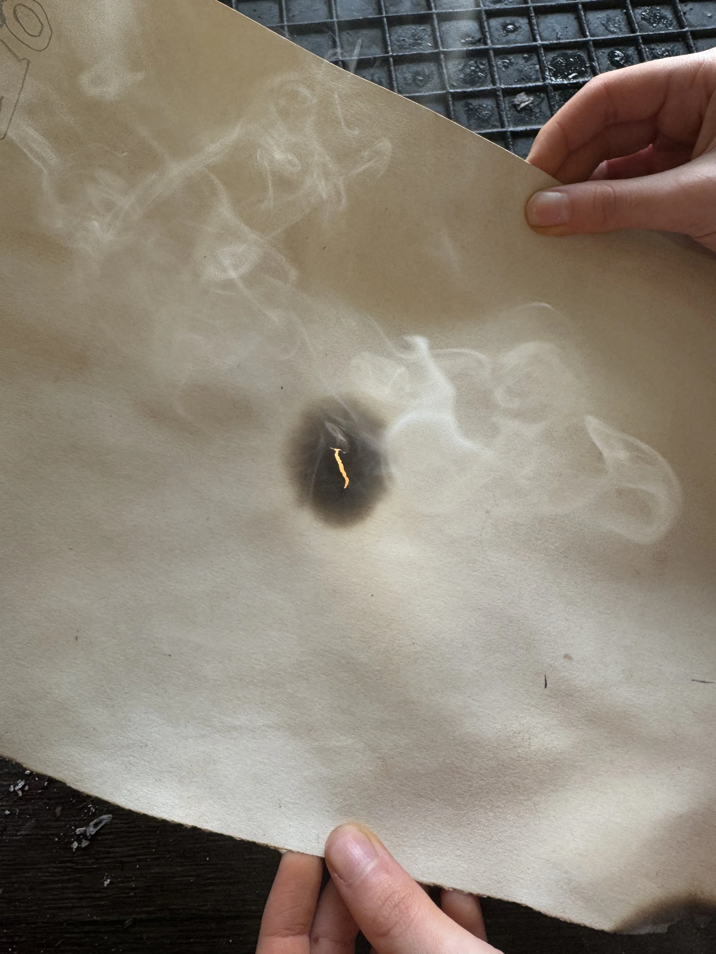 Burning holes in paper.JPG