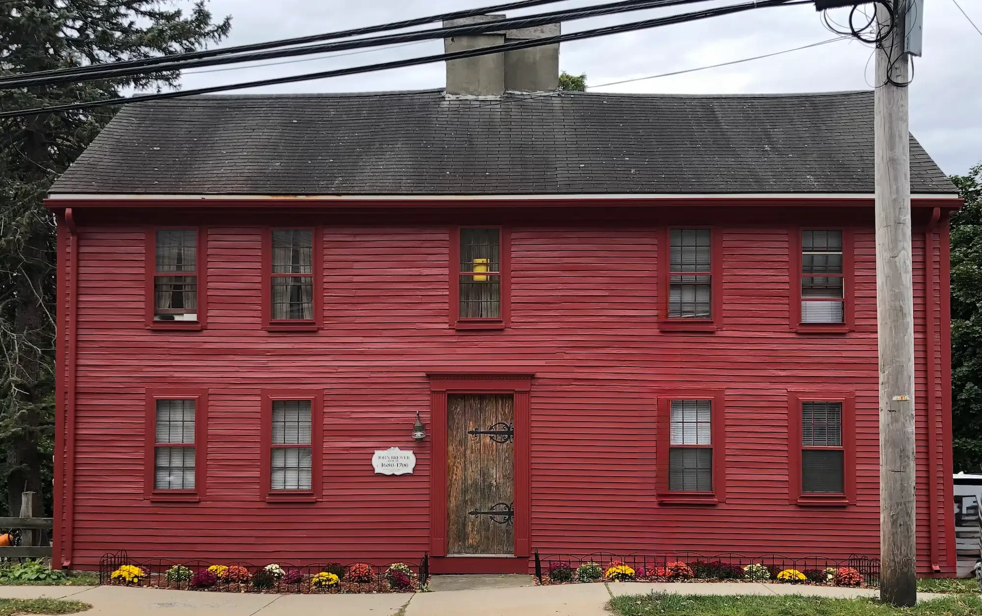 Historic colonial home exterior painting in Ipswich MA — red clapboard by Albion Contracting
