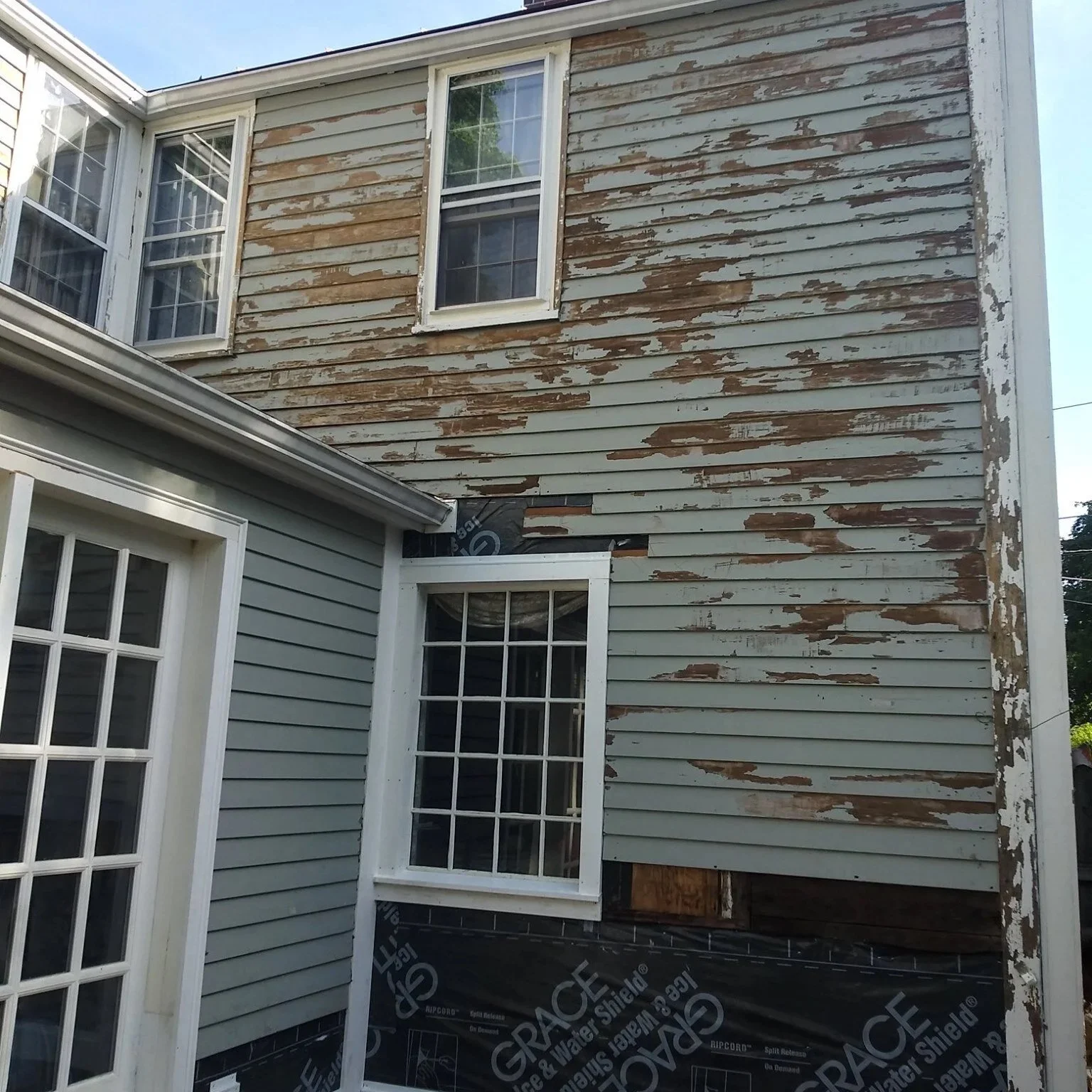 Original weathered clapboard siding detail historic home North Shore MA
