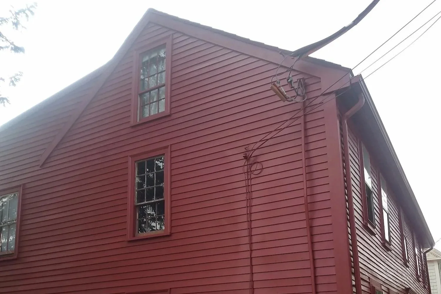 Completed exterior painting and restoration of red house Ipswich MA — Albion Contracting