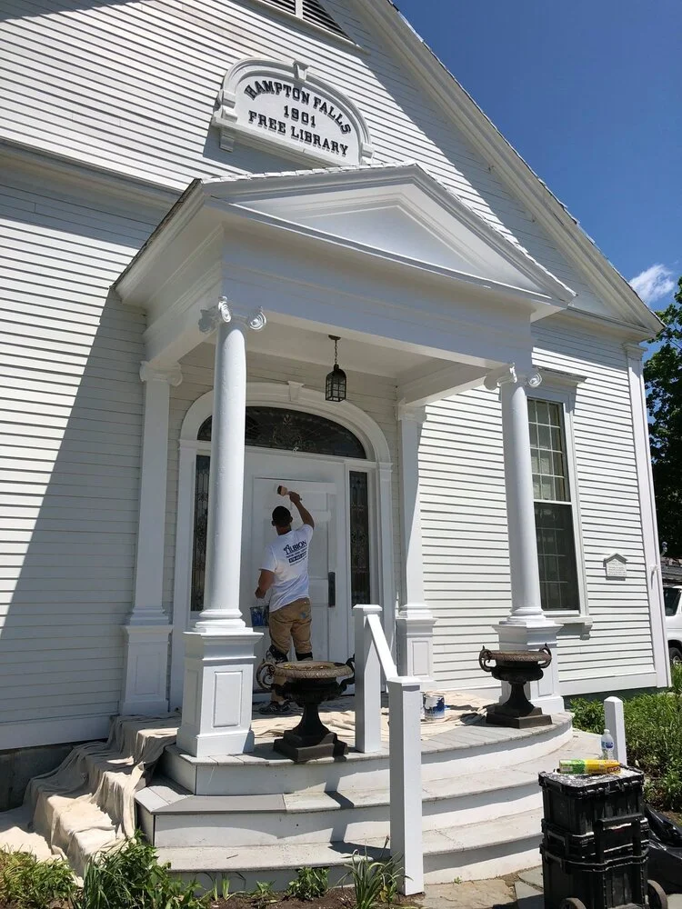  Hampton Falls Free Library, a white historic building with columns and steps.