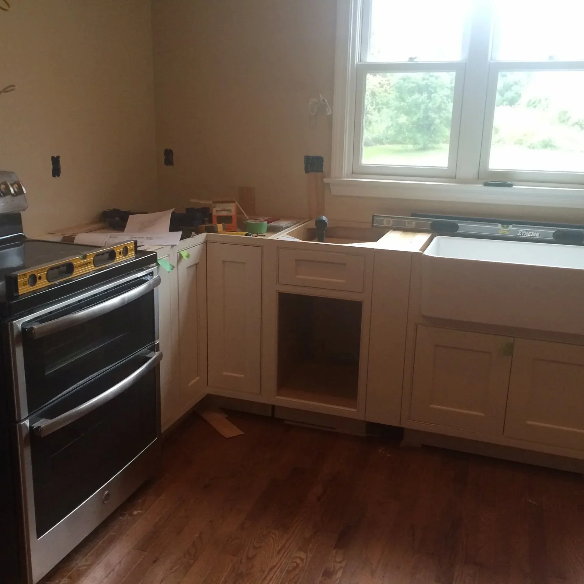 Kitchen remodel white shaker cabinets hardwood floors North Shore MA