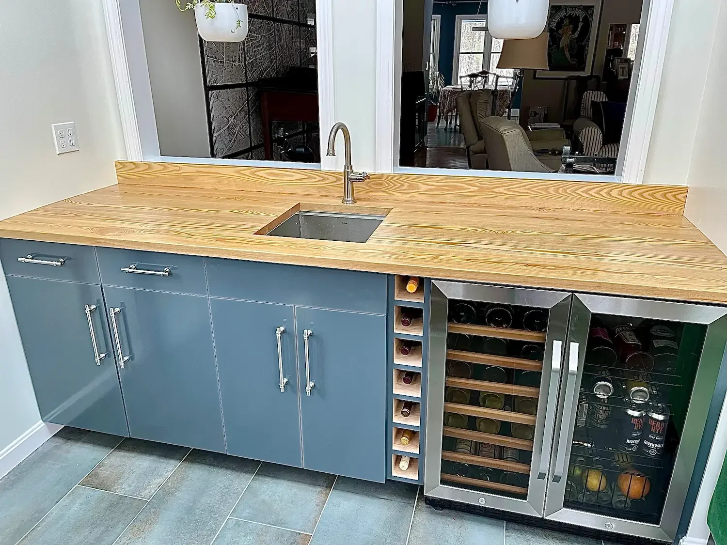 Custom bar remodel with slate blue cabinets, butcher block countertop, undermount bar sink, and built-in wine cooler — North Shore, MA