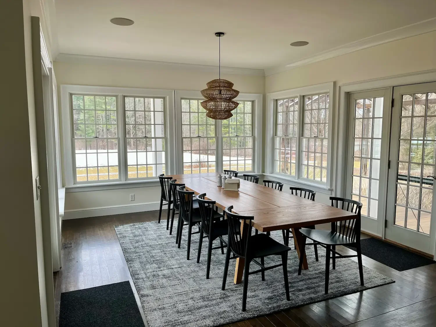 Interior painting of a Swedish inspired dining room with floor-to-ceiling grid windows, crown molding, and dark hardwood floors — Hampton, NH