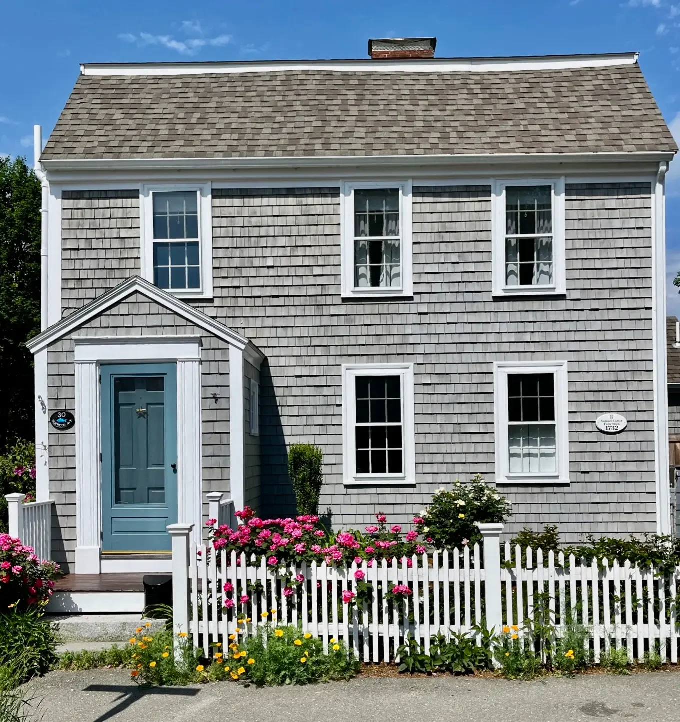 Historic 1732 colonial in Essex MA — cedar shingles and blue door painted by Albion Contracting