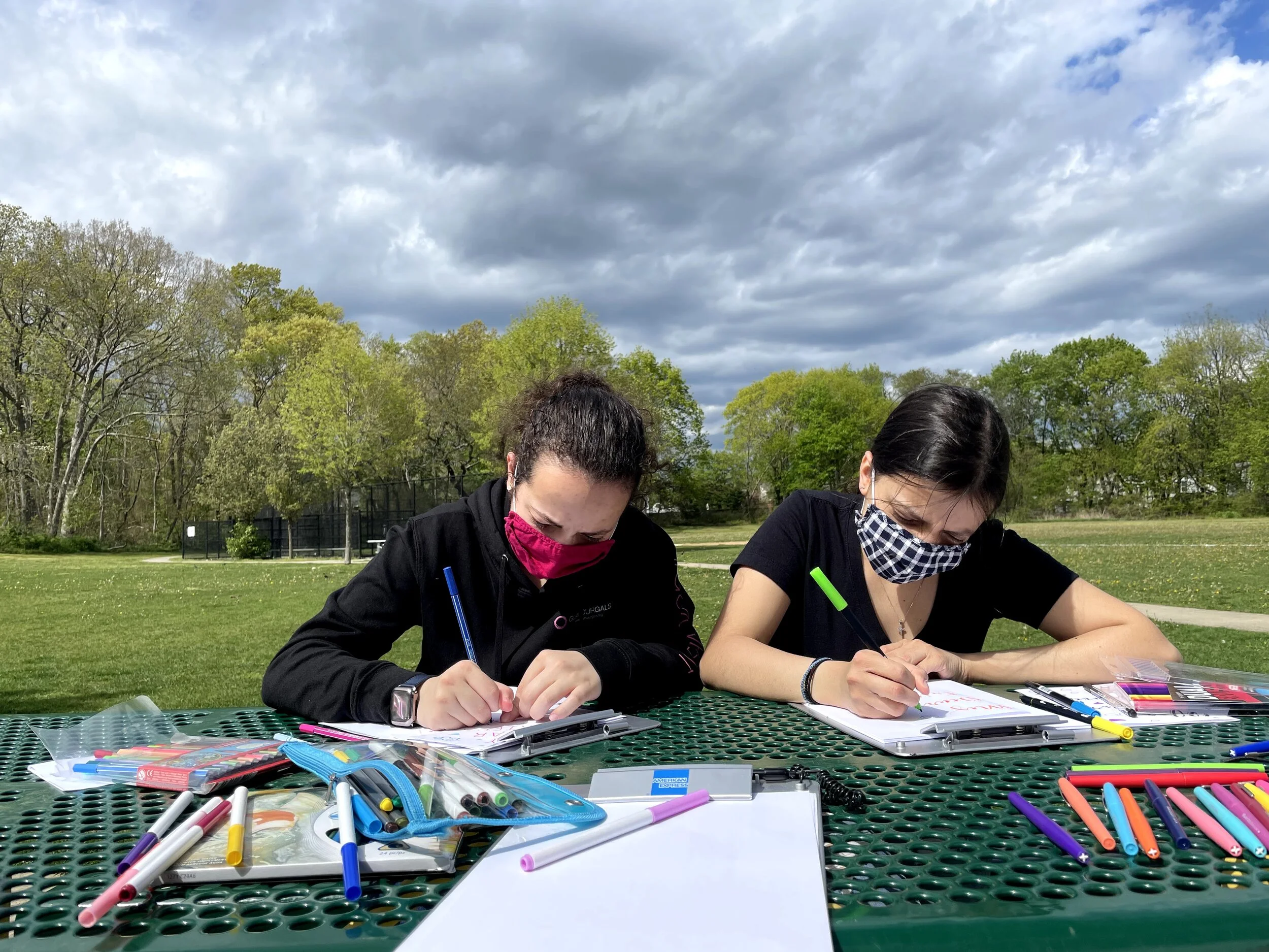 Two GlamourGals volunteers writing My Dear Friend notes.jpg