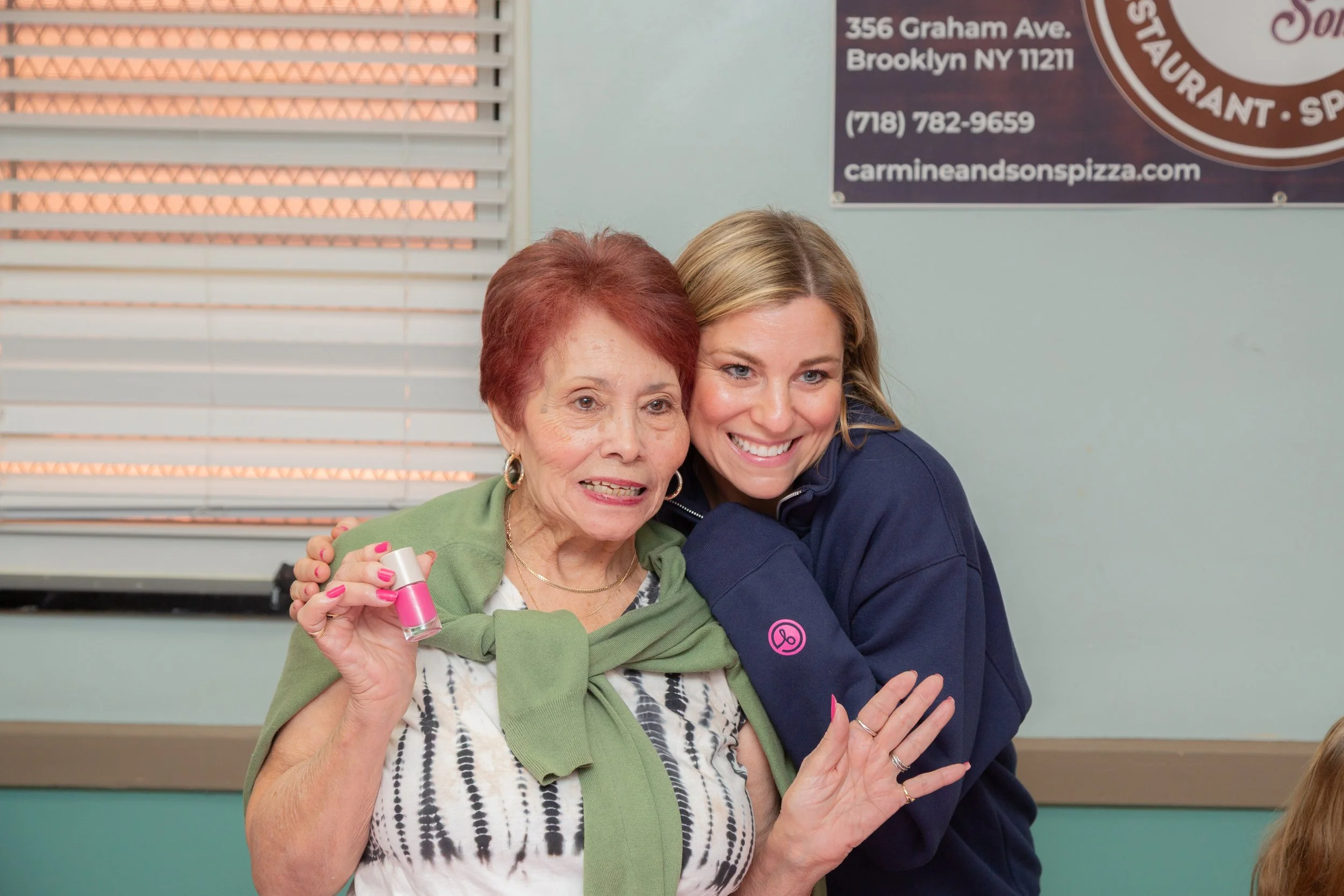 Rachel with senior holding Bold Kindness 