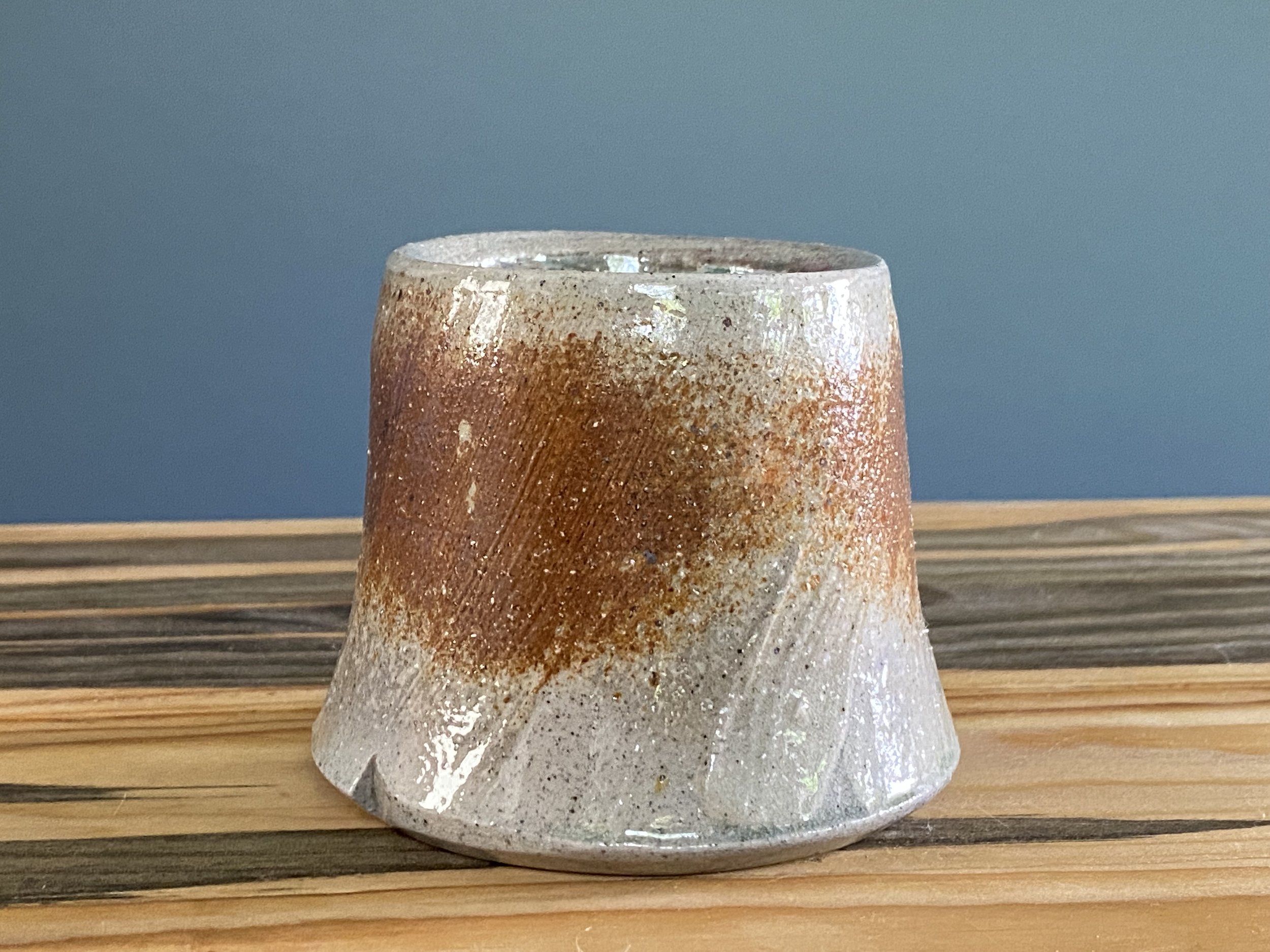 Cup with local clay slip brushed onto exterior