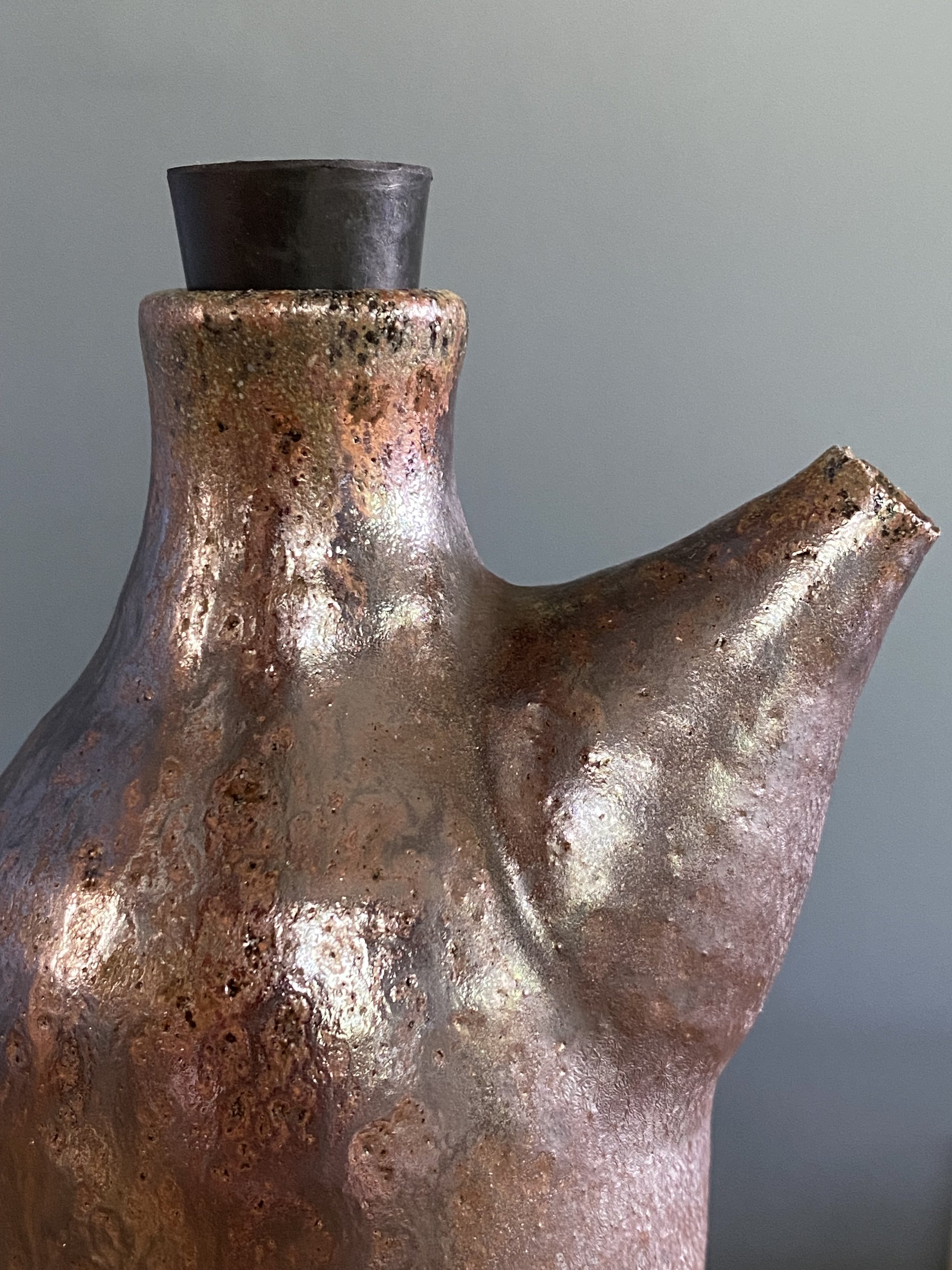 Tall oil bottle in dark stoneware