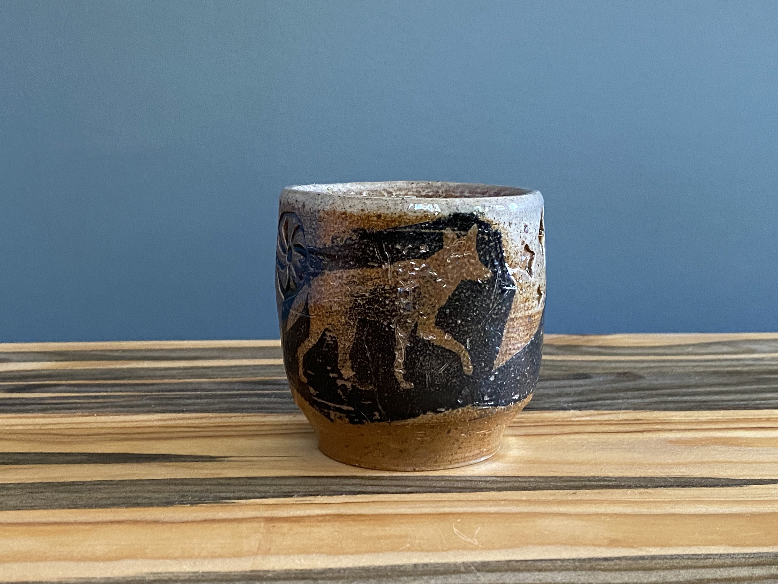 Stoneware cup with handmade monoprint transfers and stamped imagery