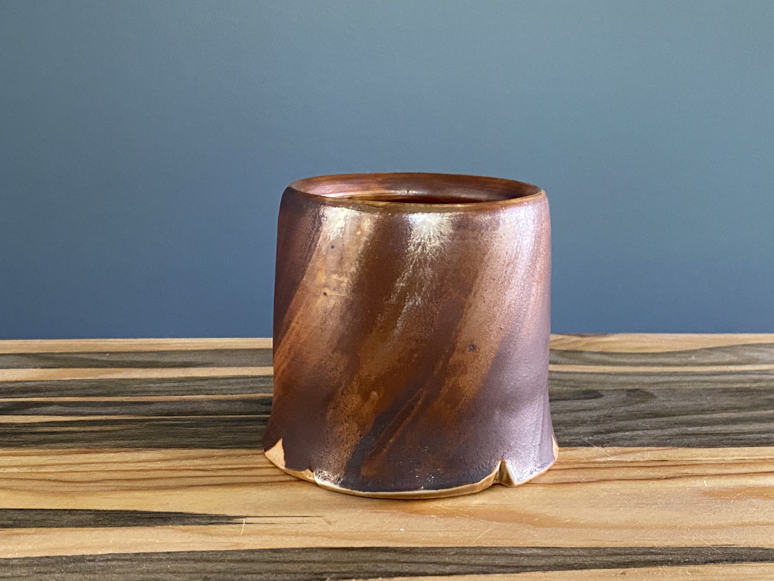 Cup with local clay slip brushed onto exterior