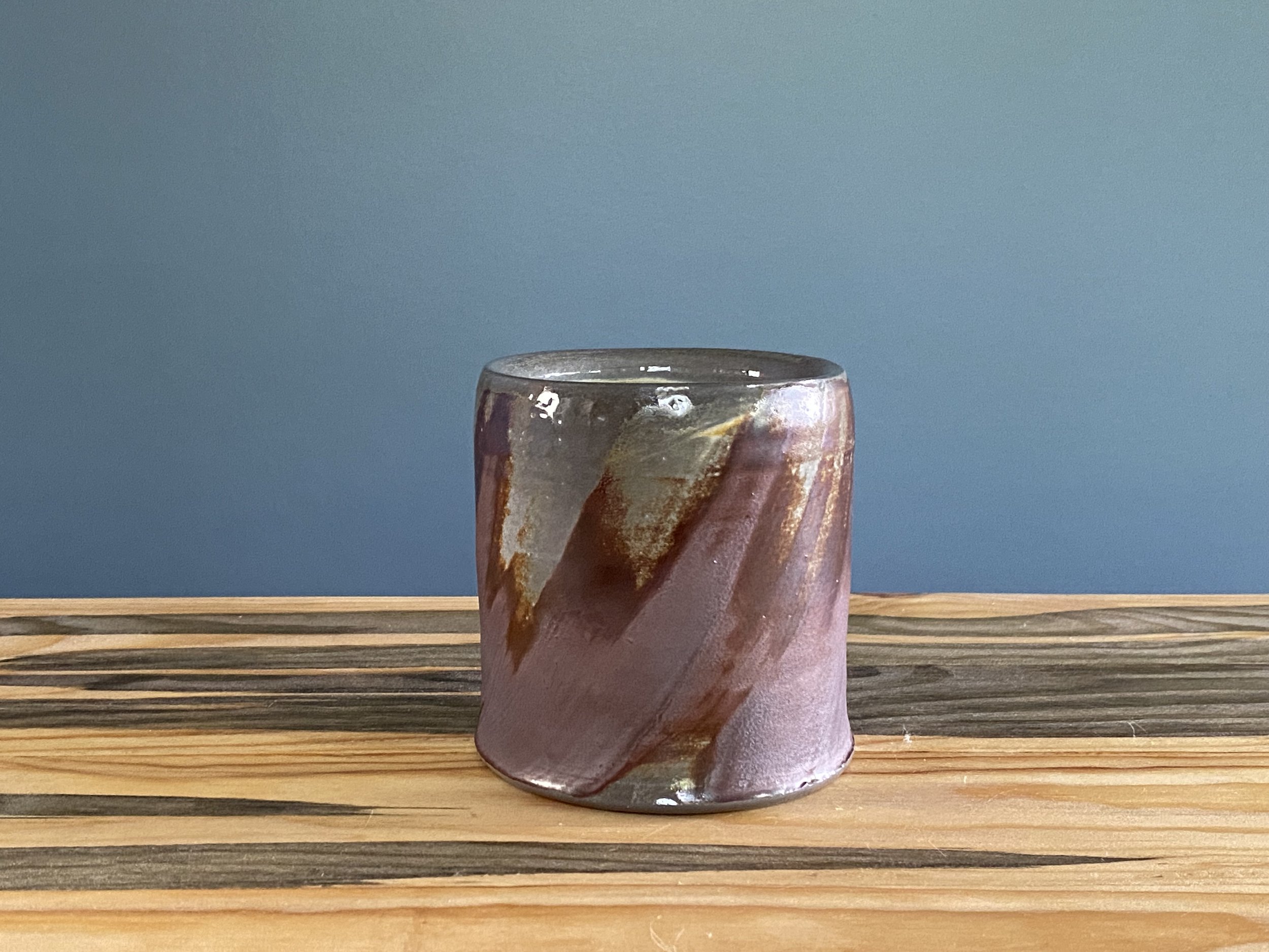 Cup with local clay slip brushed onto exterior