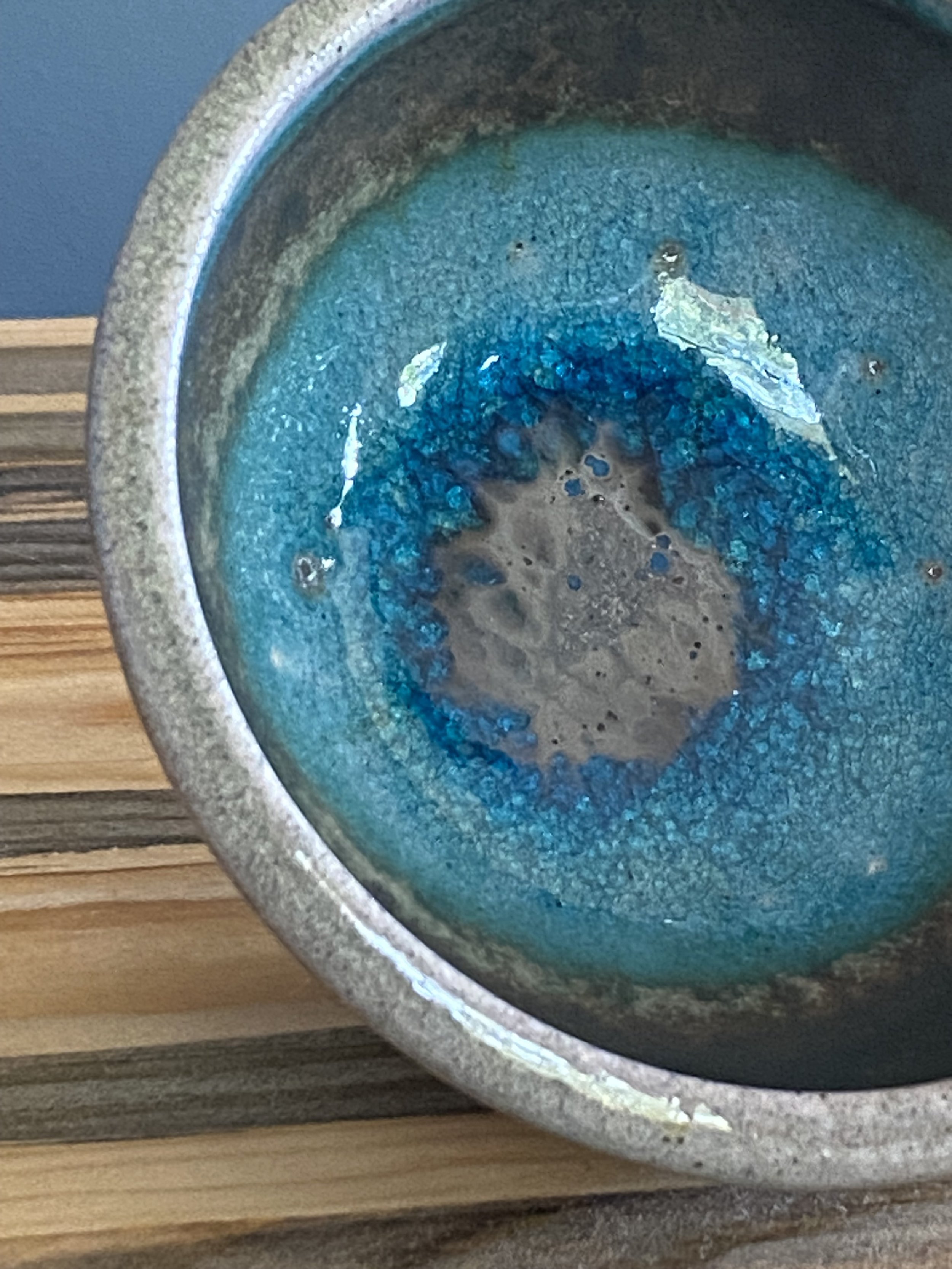 Stoneware bowl with turquoise glaze and soda glass interior