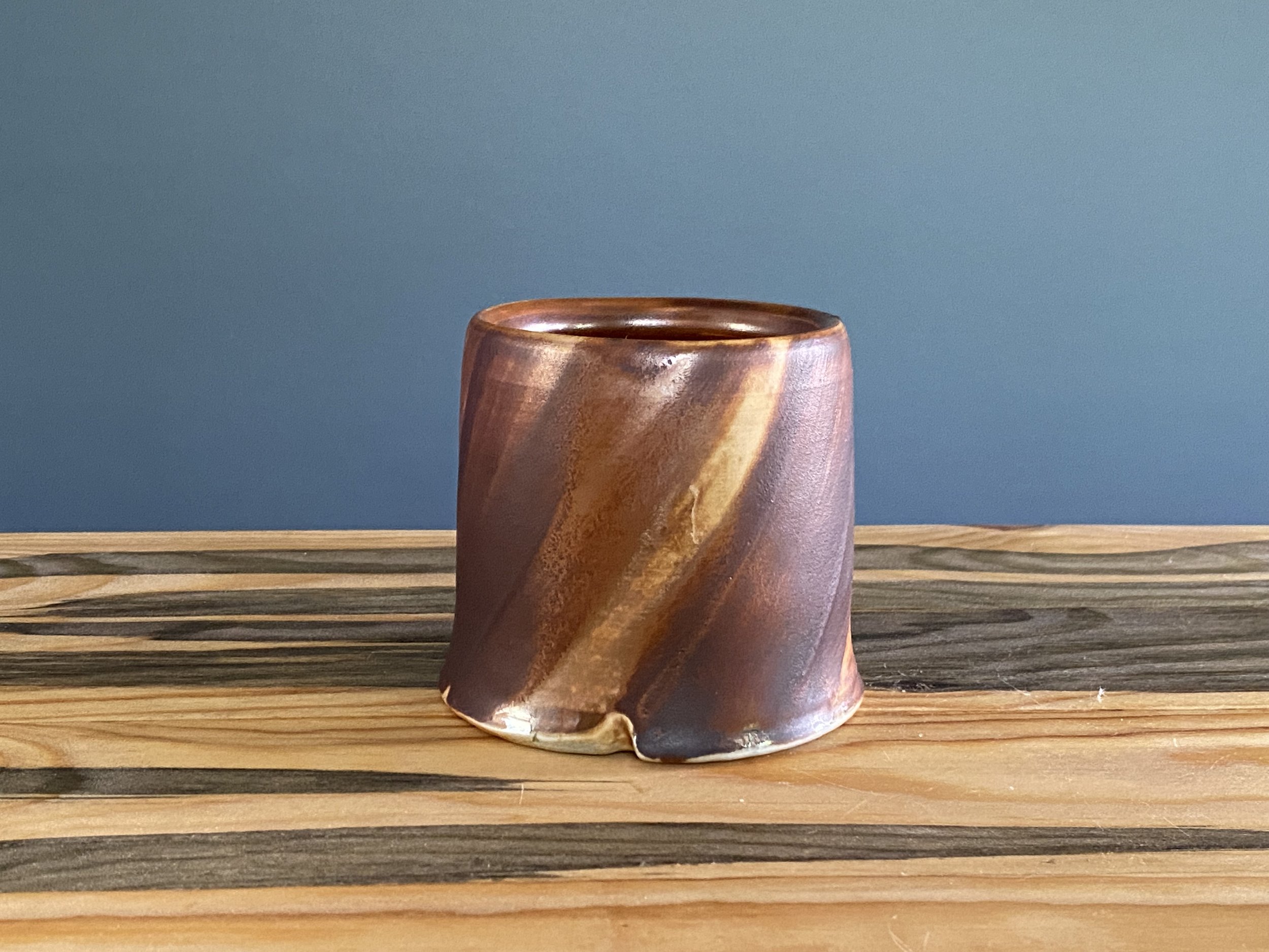 Cup with local clay slip brushed onto exterior