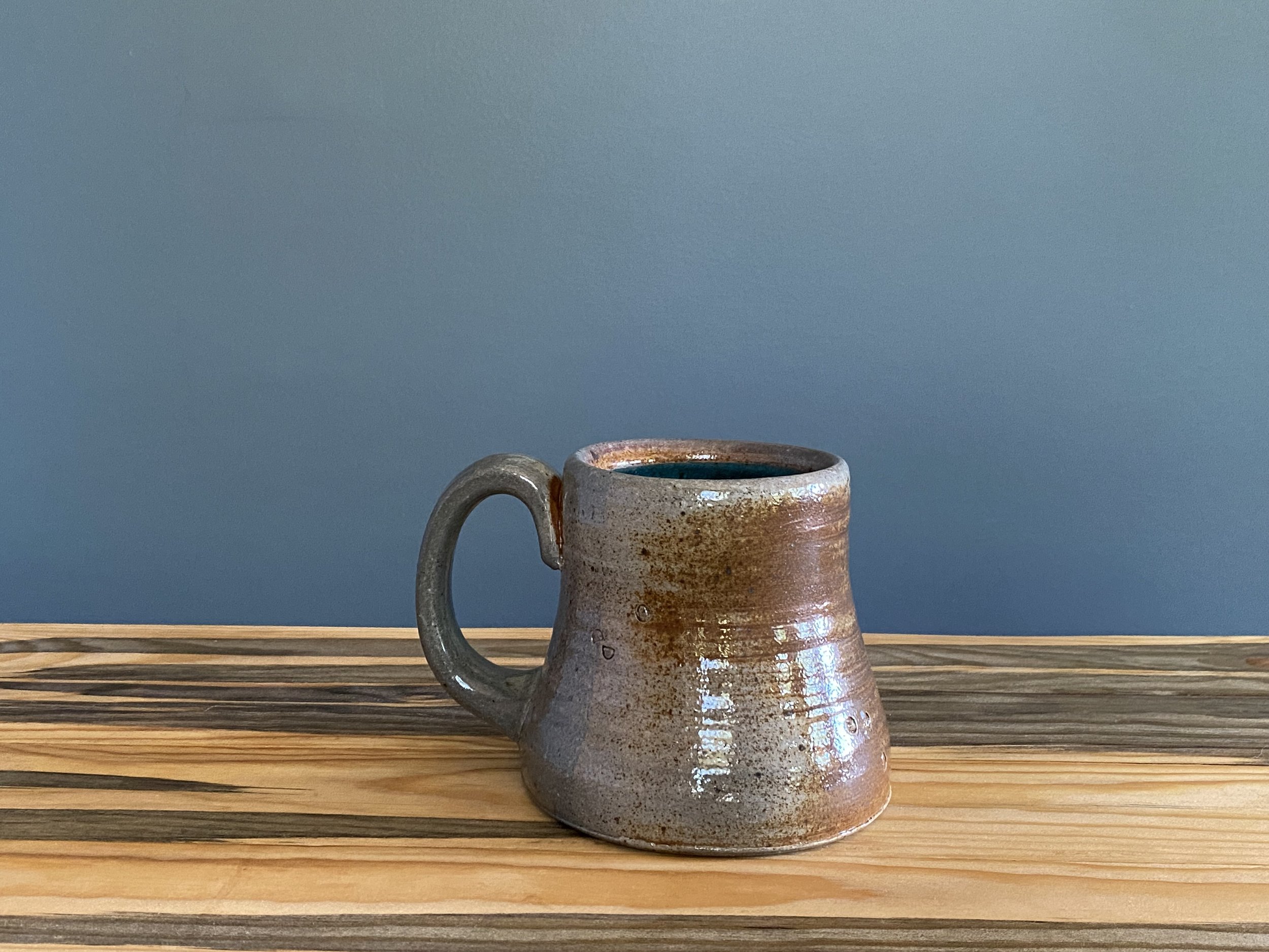 Stoneware mug with foraged material stamps