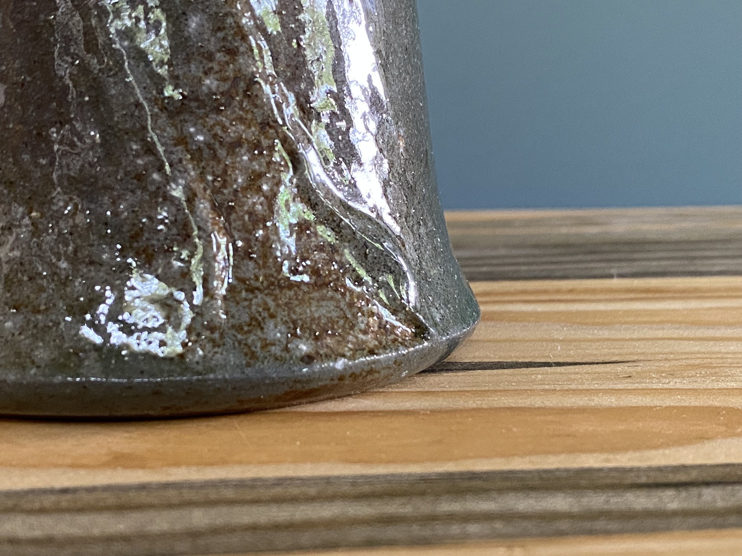 Cup with local clay slip brushed onto exterior