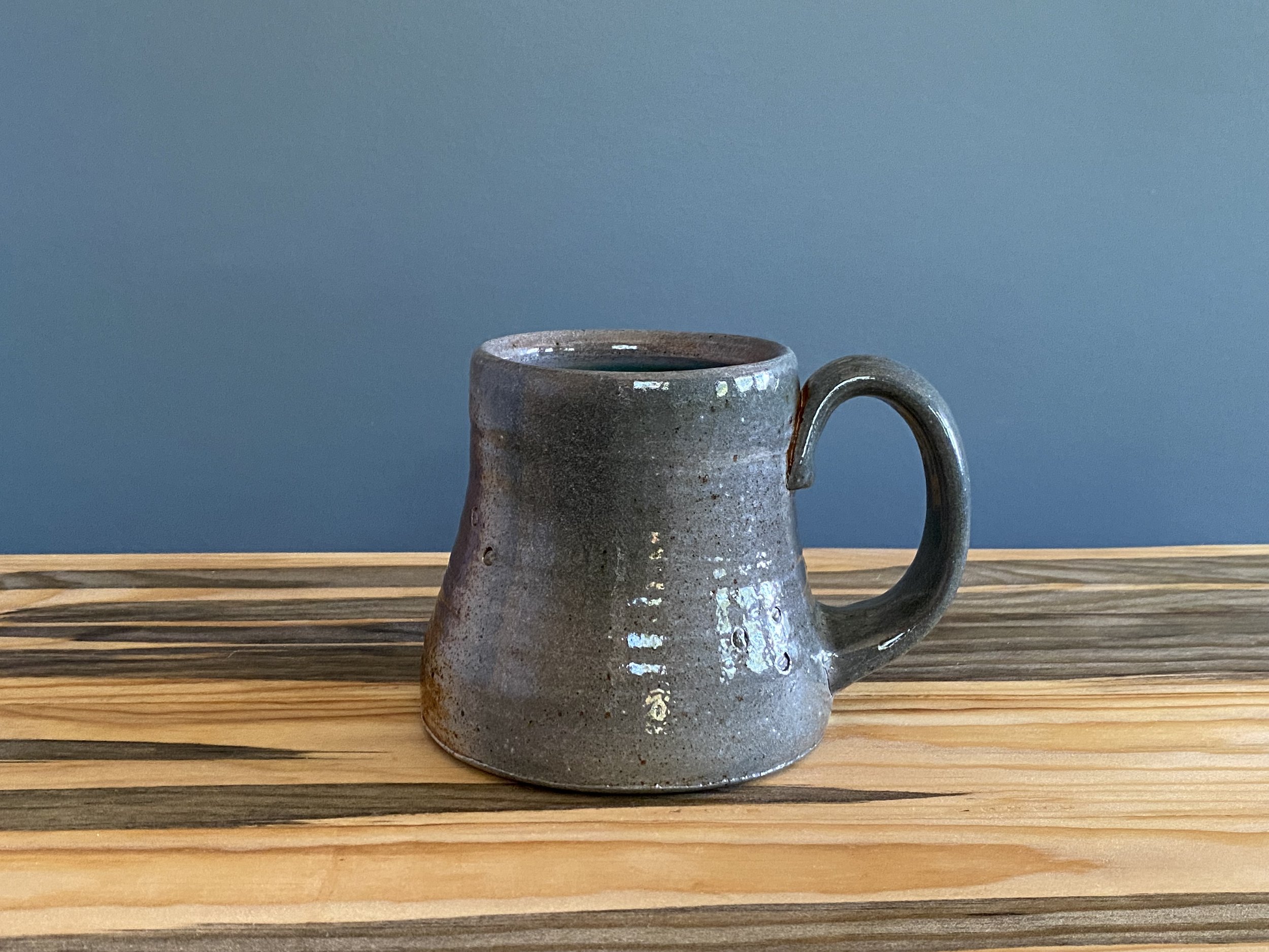 Stoneware mug with foraged material stamps