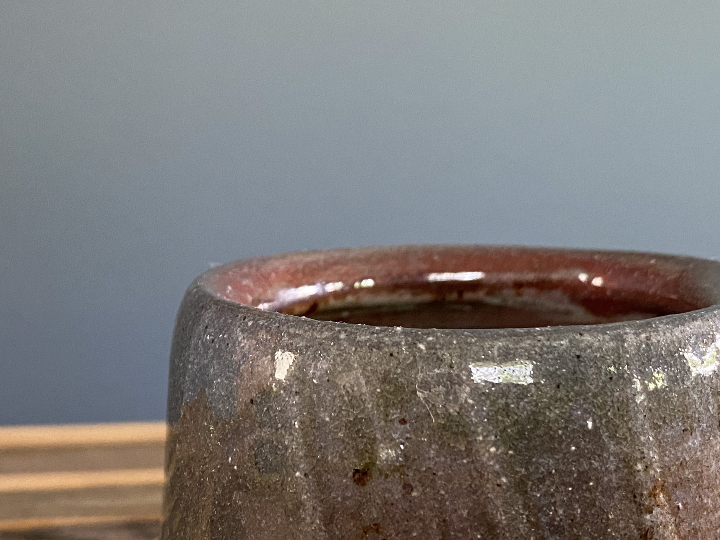 Cup with local clay slip brushed onto exterior