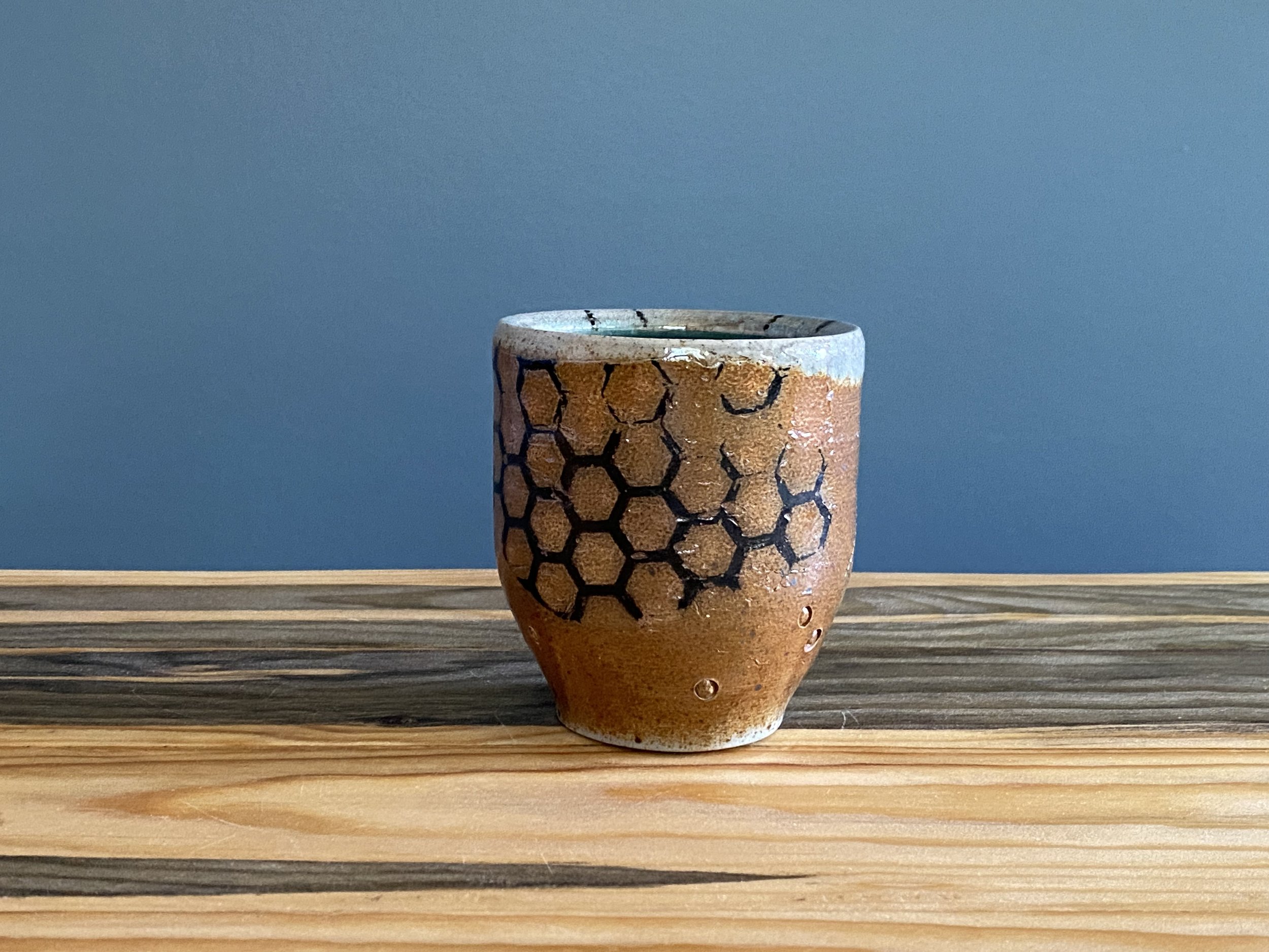 Stoneware cup with handmade monoprint transfers and stamped imagery