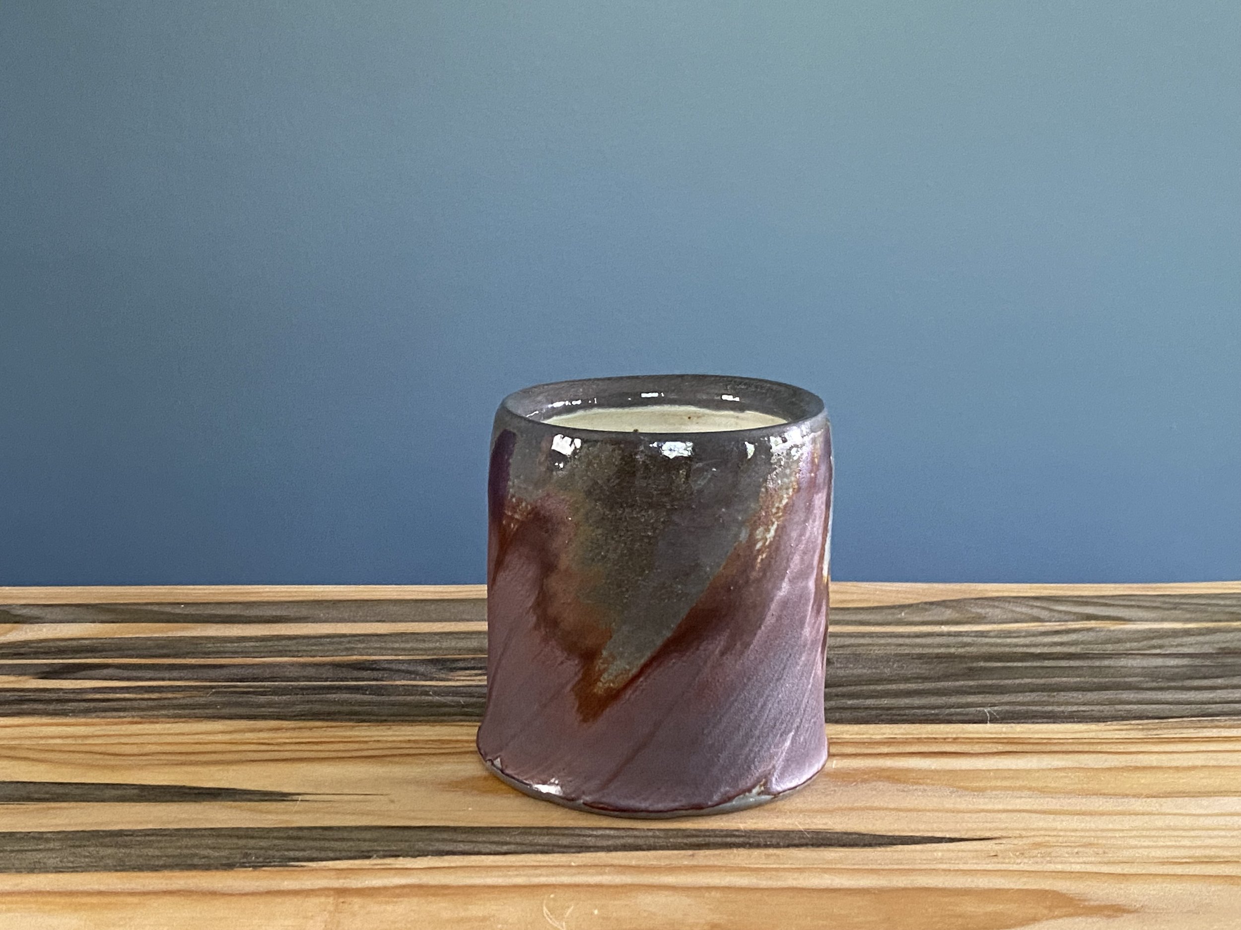 Cup with local clay slip brushed onto exterior
