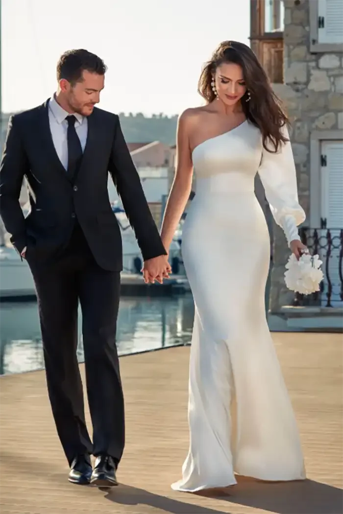 savvi-bridal-bride-groom-model-one-sleeve-satin-wedding-dress-raleigh.webp
