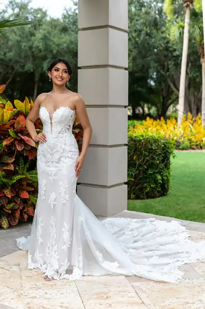 savvi-bridal-lace-deep-V-fitted-on-model-wedding-dress-raleigh.webp