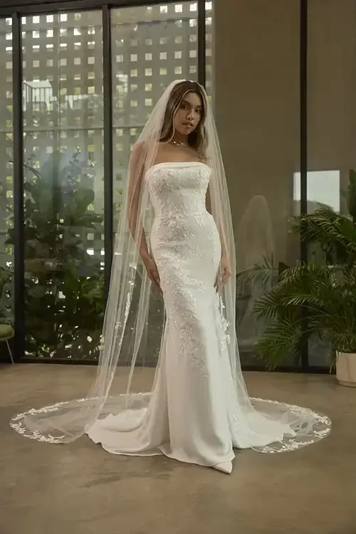 fitted-lace-crepe-on-model-wedding-dress-with-lace-cathedral-veil-savvi-raleigh-nc.webp