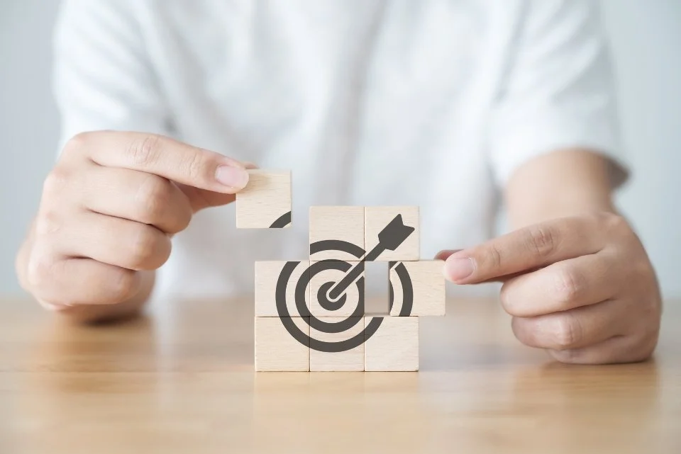 a puzzle block with an arrow hitting the bullseye