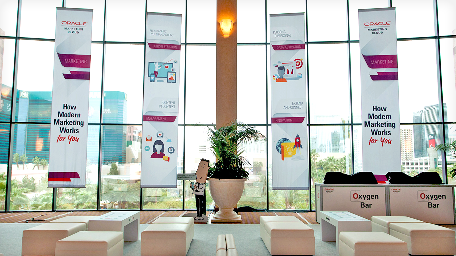 Banners in the Social Lounge that highlights Oracle Marketing Cloud's four main goals: orchestration, engagement, data activation, and innovation.
