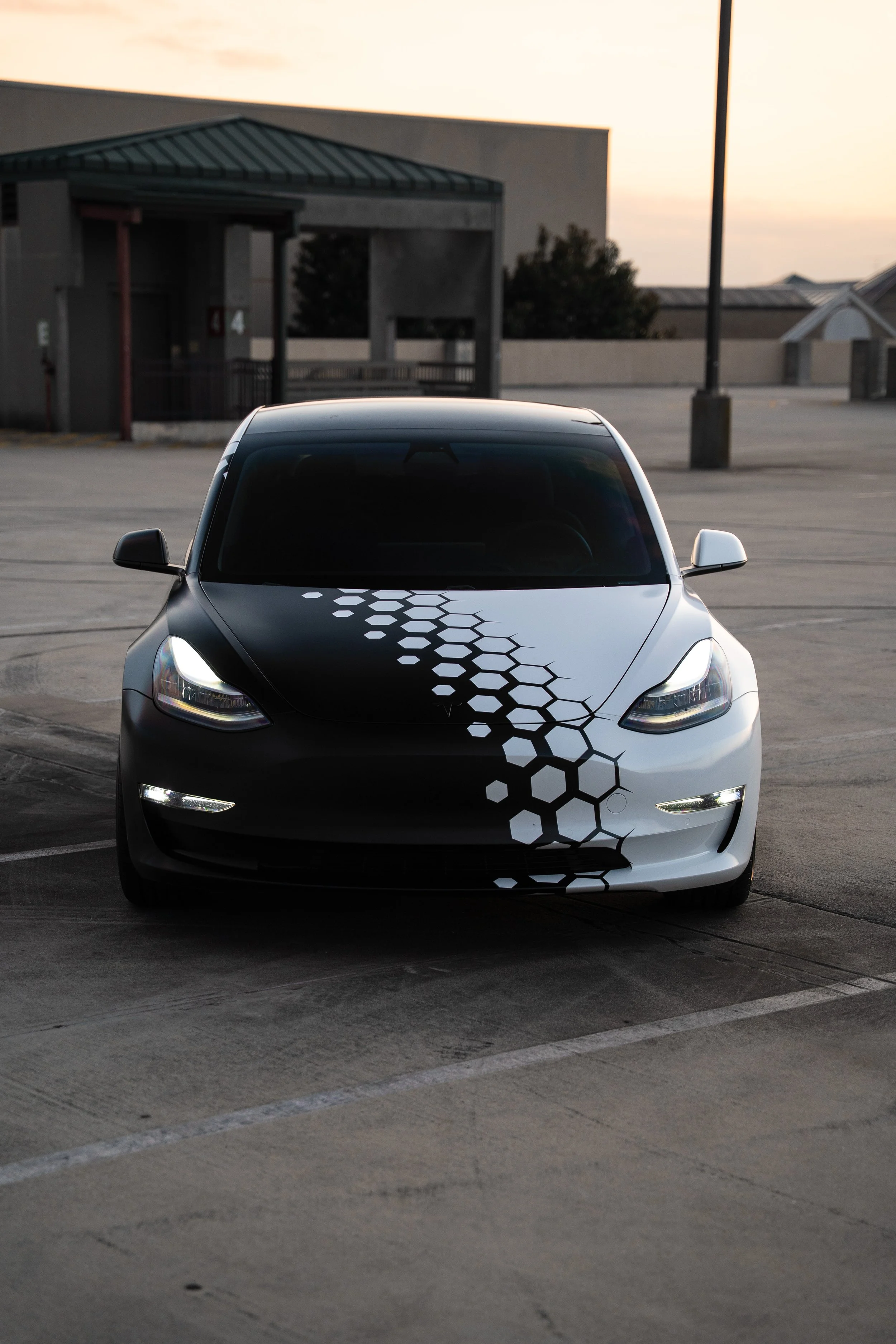 Precision Wraps & Graphics - Tesla Model 3 wrapped in Black and white hexagon design