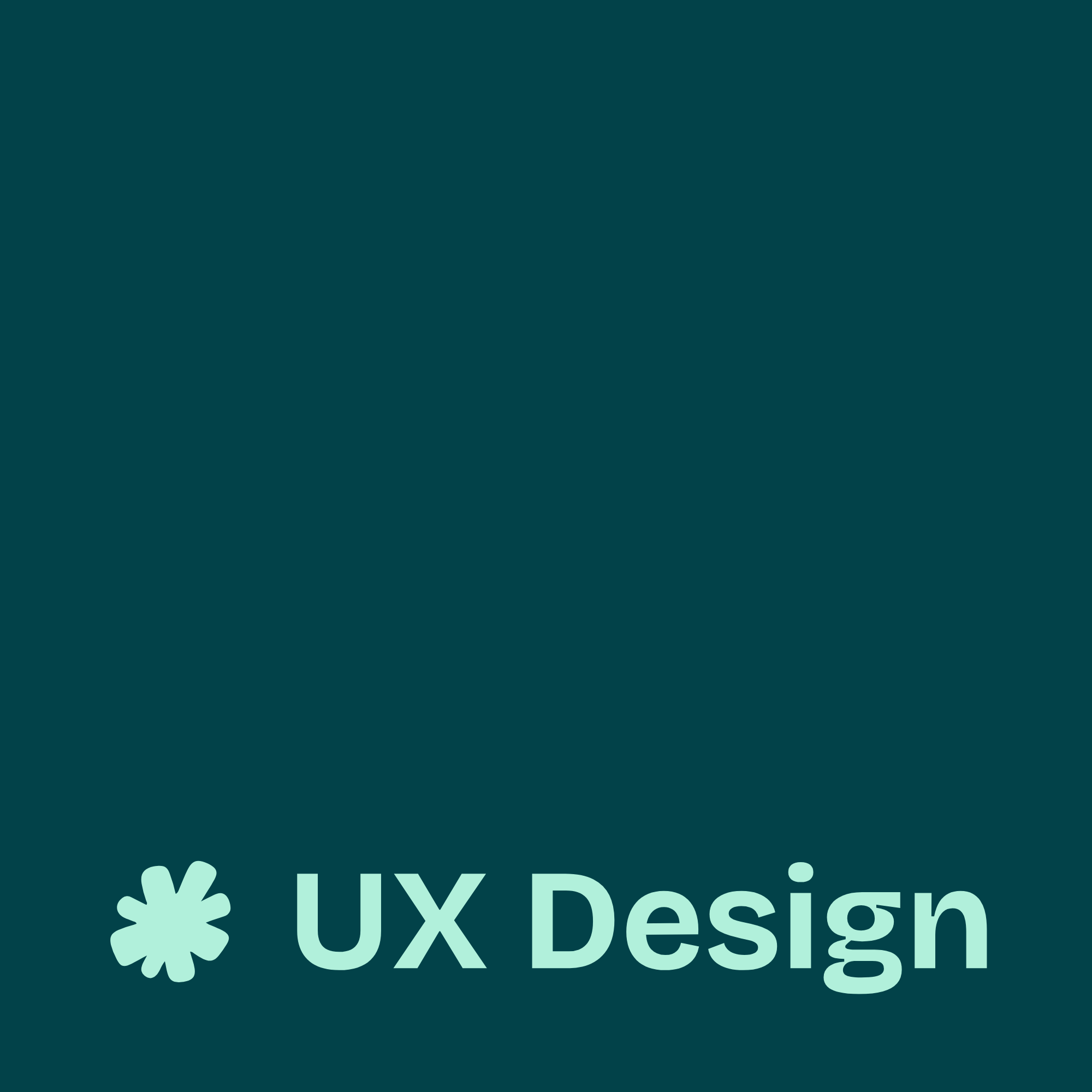 Overhead view of a desk with a black surface, featuring a computer keyboard, a wireless mouse, a pair of wireless earbuds, a glass mug of tea, and a notepad with sketches of app wireframes and sticky notes. Hands are seen placing and writing on pink sticky notes.