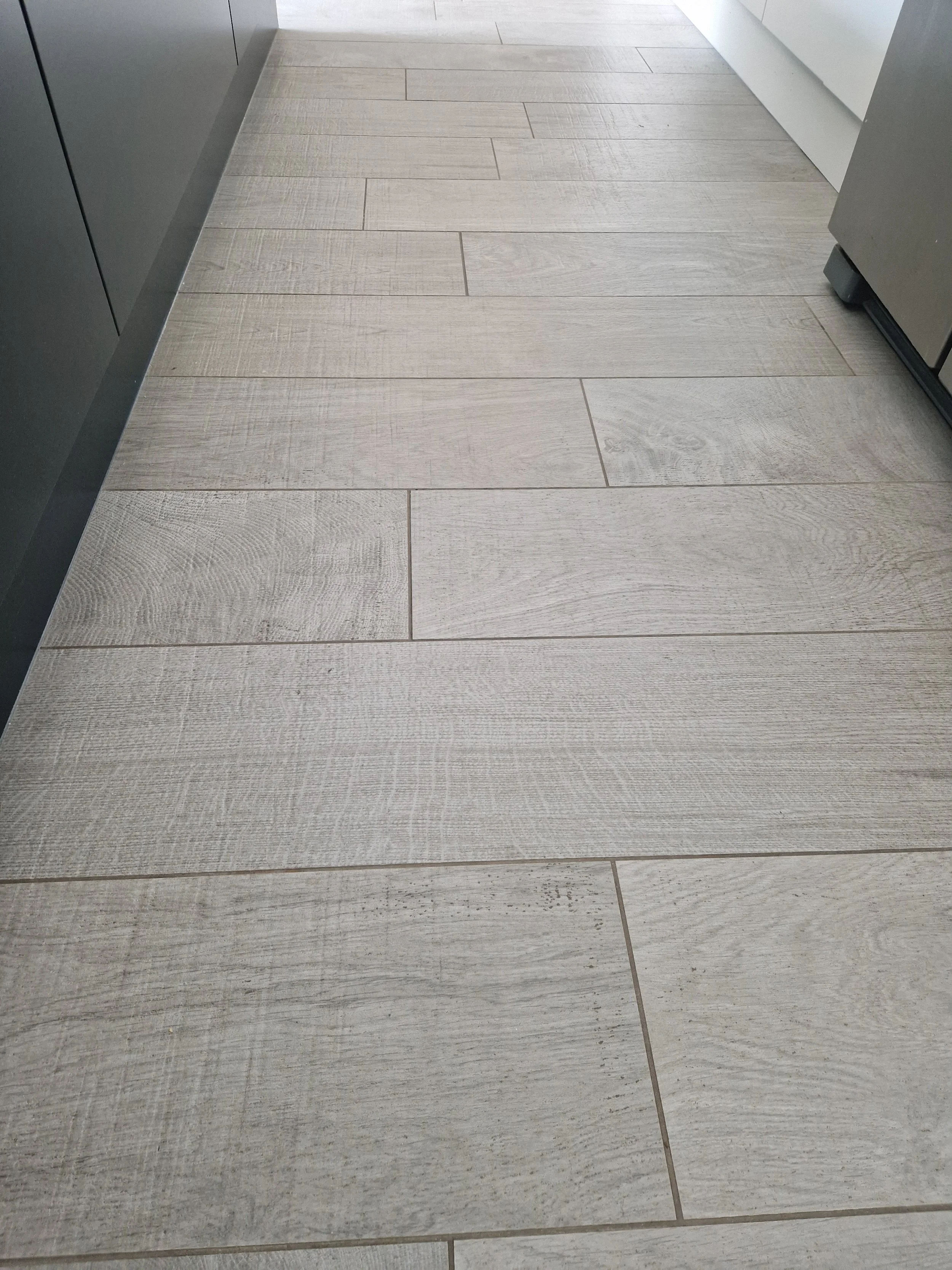 porcelain tall units matt black knurled handles true handleless handless matt anthracite truffle brown denver oak NEFF integrated coffee machine neff compact oven neff microwave CDA induction hob CDA downdraft extractor downlights stone affect floor