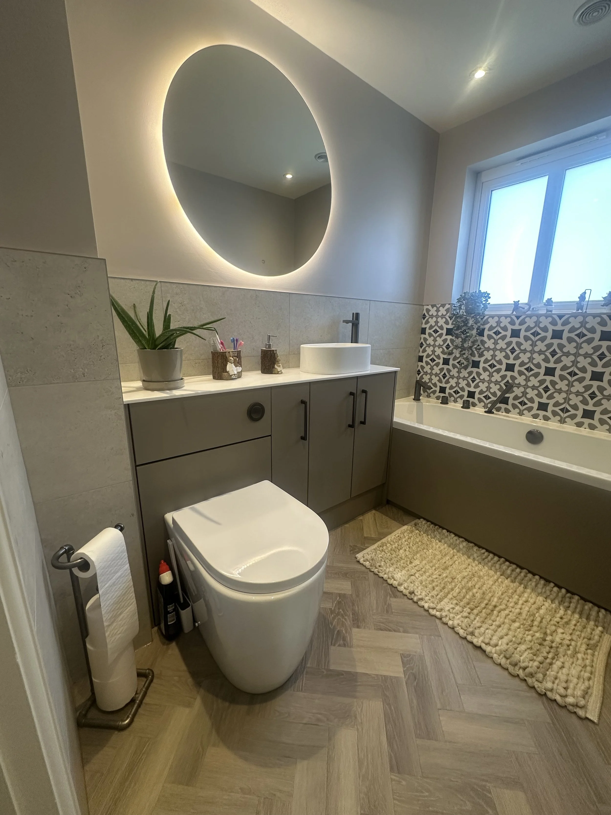 Calypso fitted furniture basalt mist brecon gunmetal romy sit on basin hib tece penelope gunmetal house of Piccadilly double ended bath amtico form keel oak rivoli feature tile lines tile inka gunmtal towel warmer wendover chrome radiator burlington