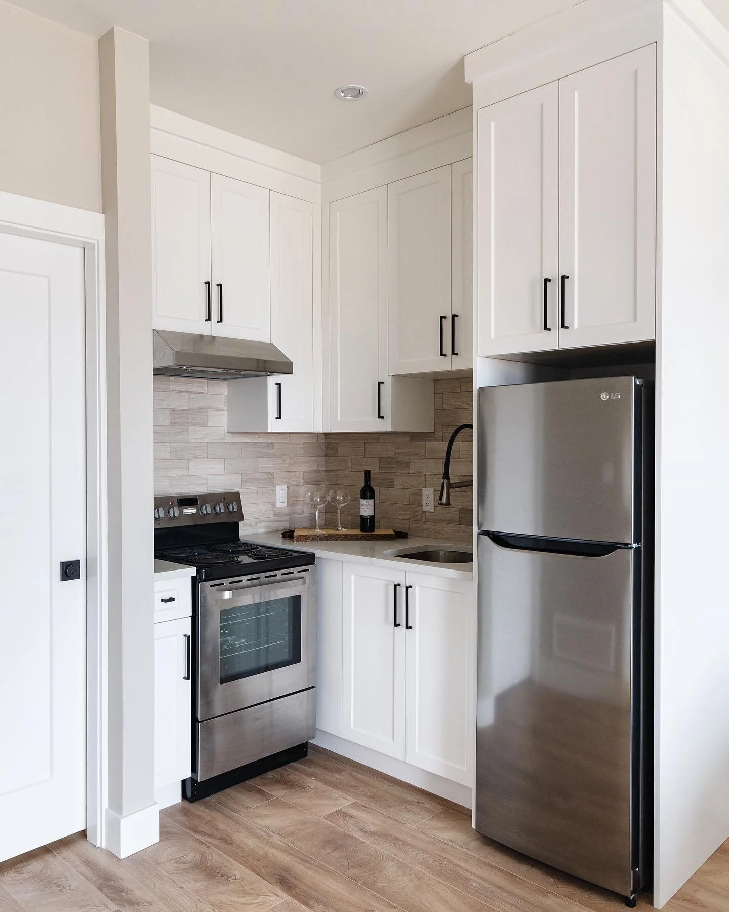We love how this corner kitchen design looks!! Our clients wanted to maximize their studio suite and rental potential, and this corner kitchen did just that, and they were able to splurge on the finishing details!!

Are you interested in learning mor