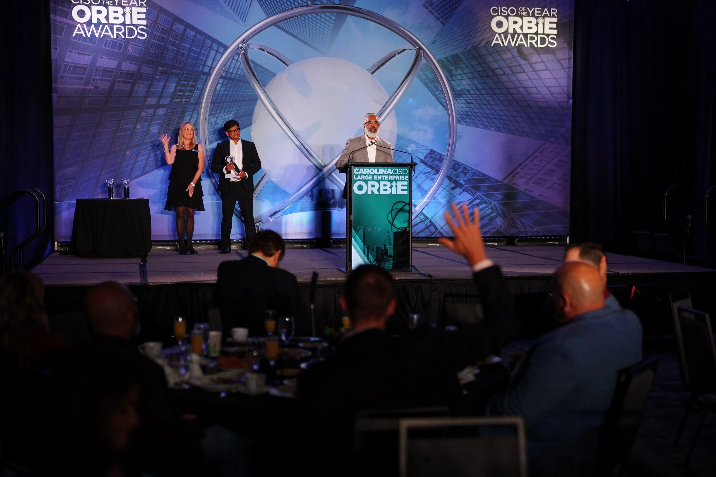 charlotte orbie award winner at podium giving speech by brandon pickett photography