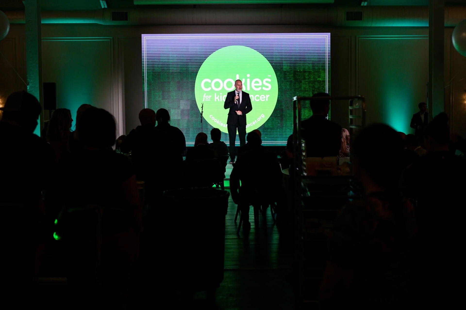 A speech during Cookies For Kids Cancer event at The Casey. By Charlotte photographer, Brandon Pickett.
