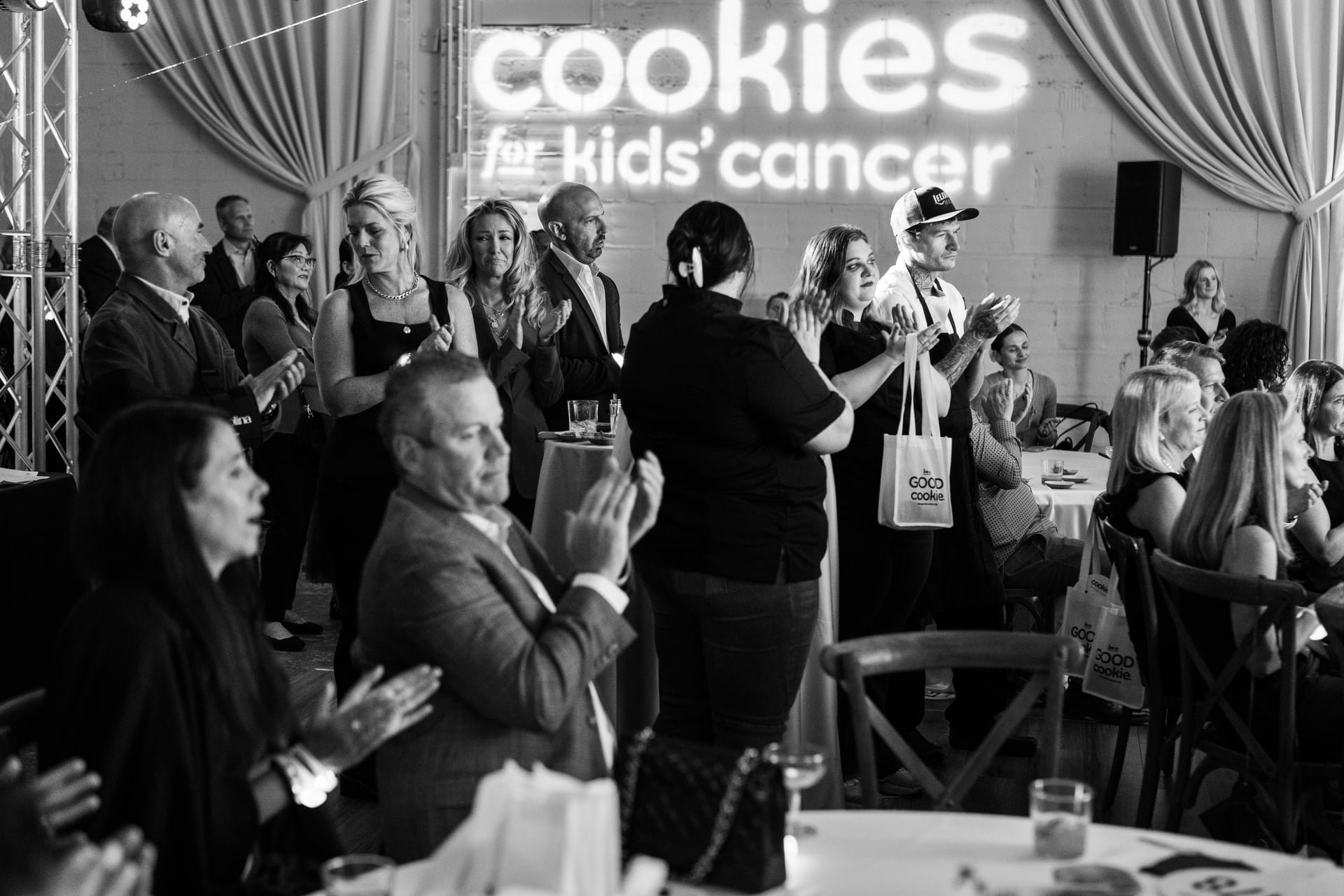 crowd claps after speech at The Casey during Cookies For Kids Cancer event.By Charlotte photographer, Brandon Pickett