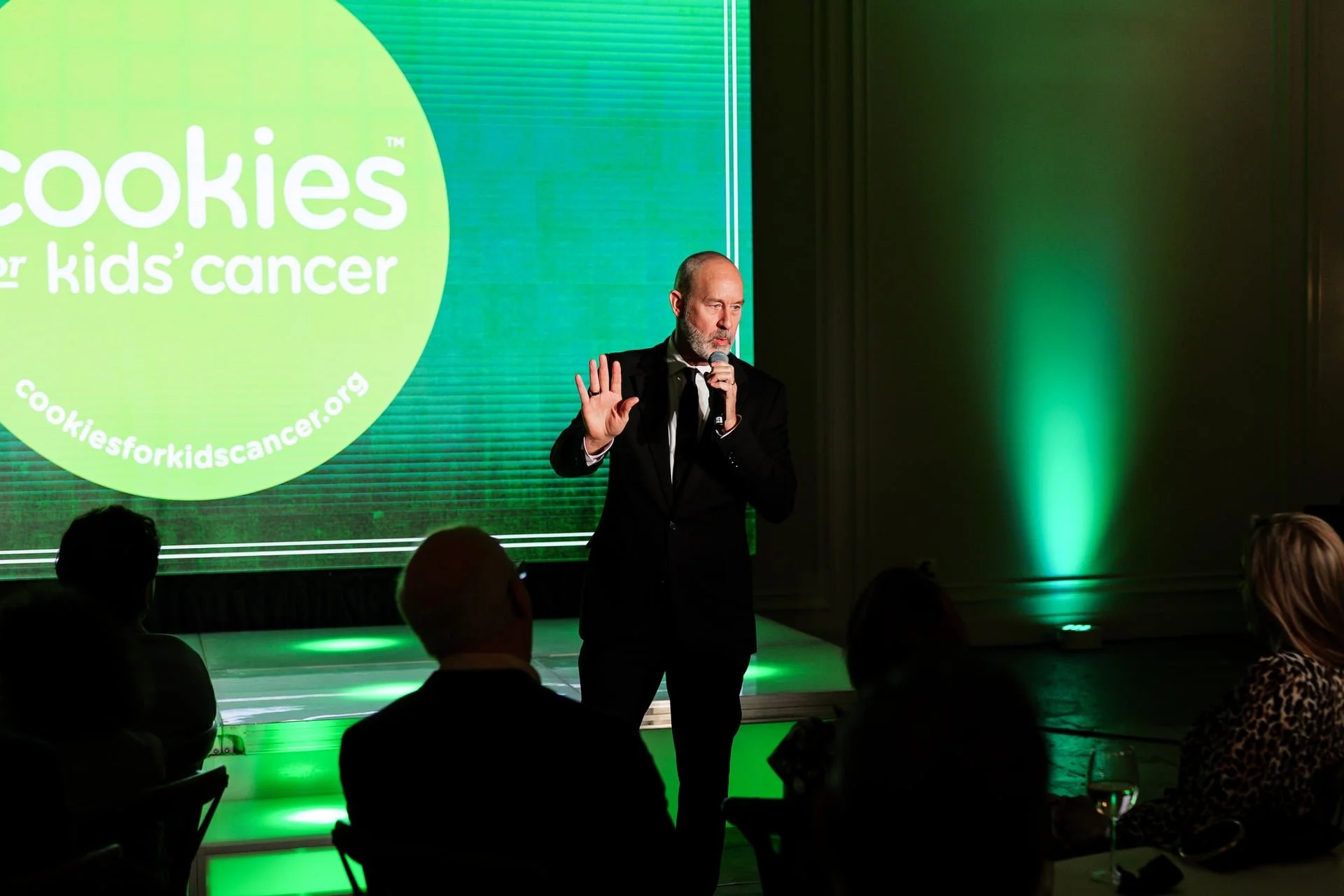 man giving speech at The Casey in Charlotte, NC for Cookies For Kids Cancer event. photo by Charlotte photographer, Brandon Pickett