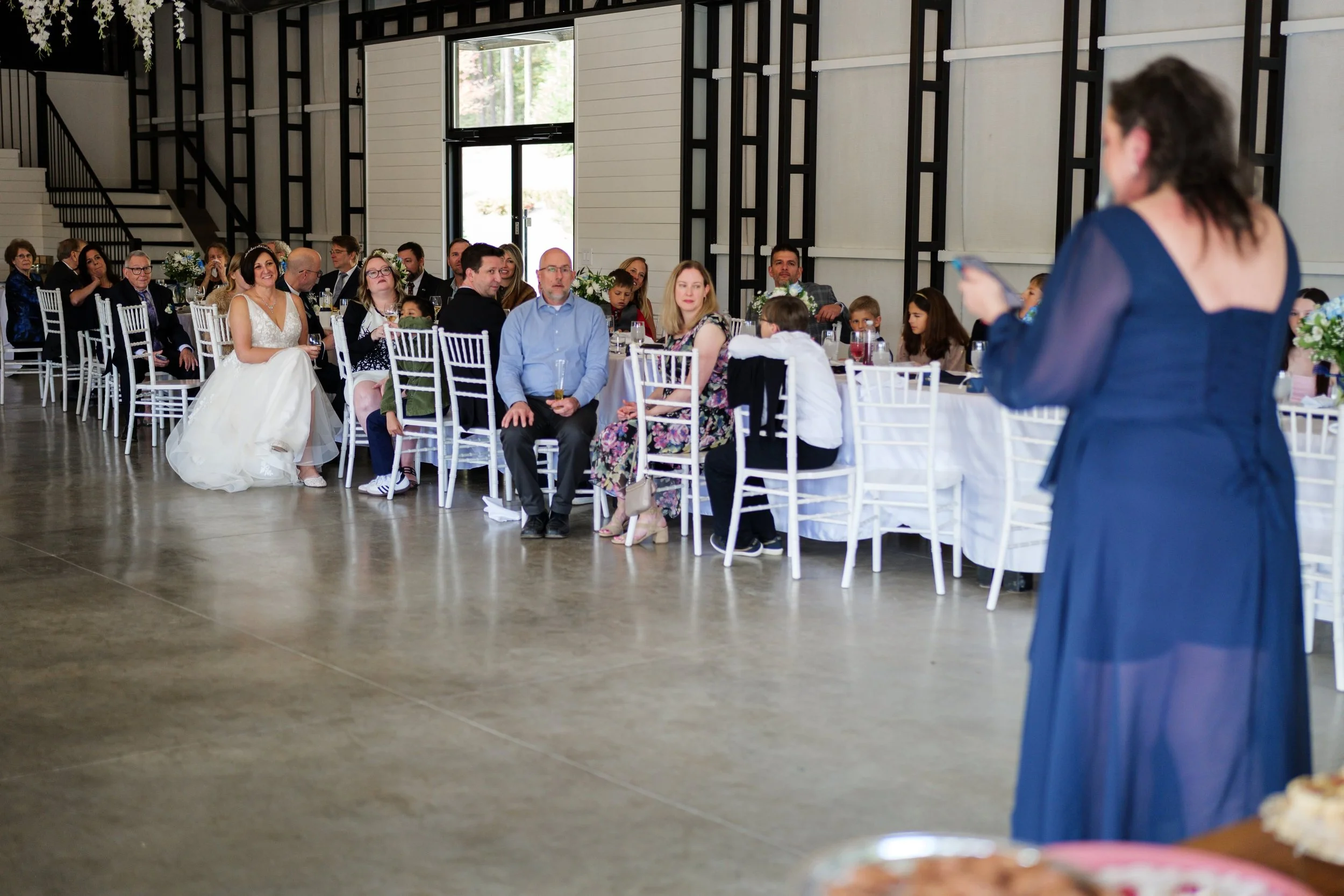  Candid reception toasts at a Charlotte wedding venue 