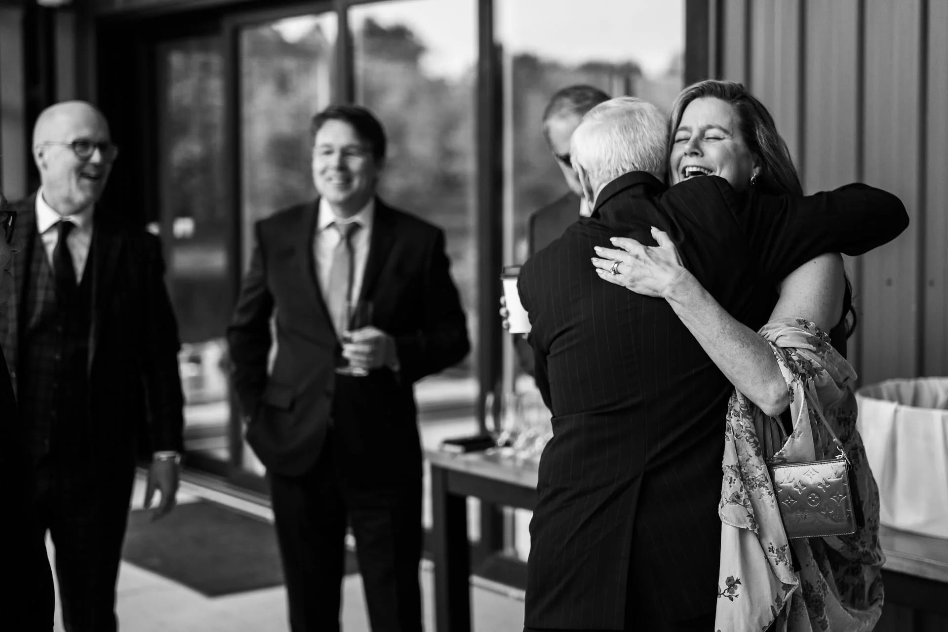  Wedding guests hugging and celebrating at Splendor Pond Flower Farm 