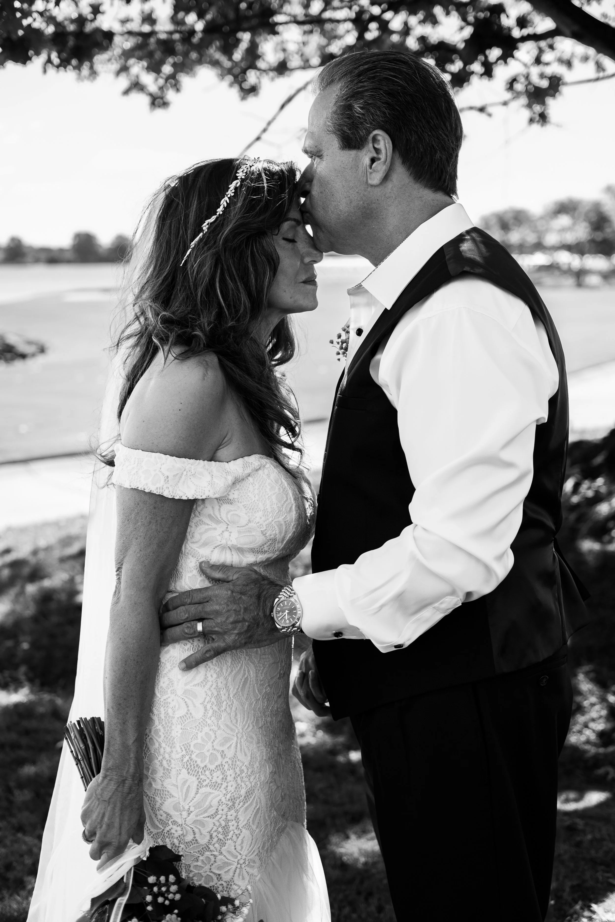 groom kissing bride on the forehead. black & white wedding photography by Charlotte wedding photographer, Brandon Pickett Photography