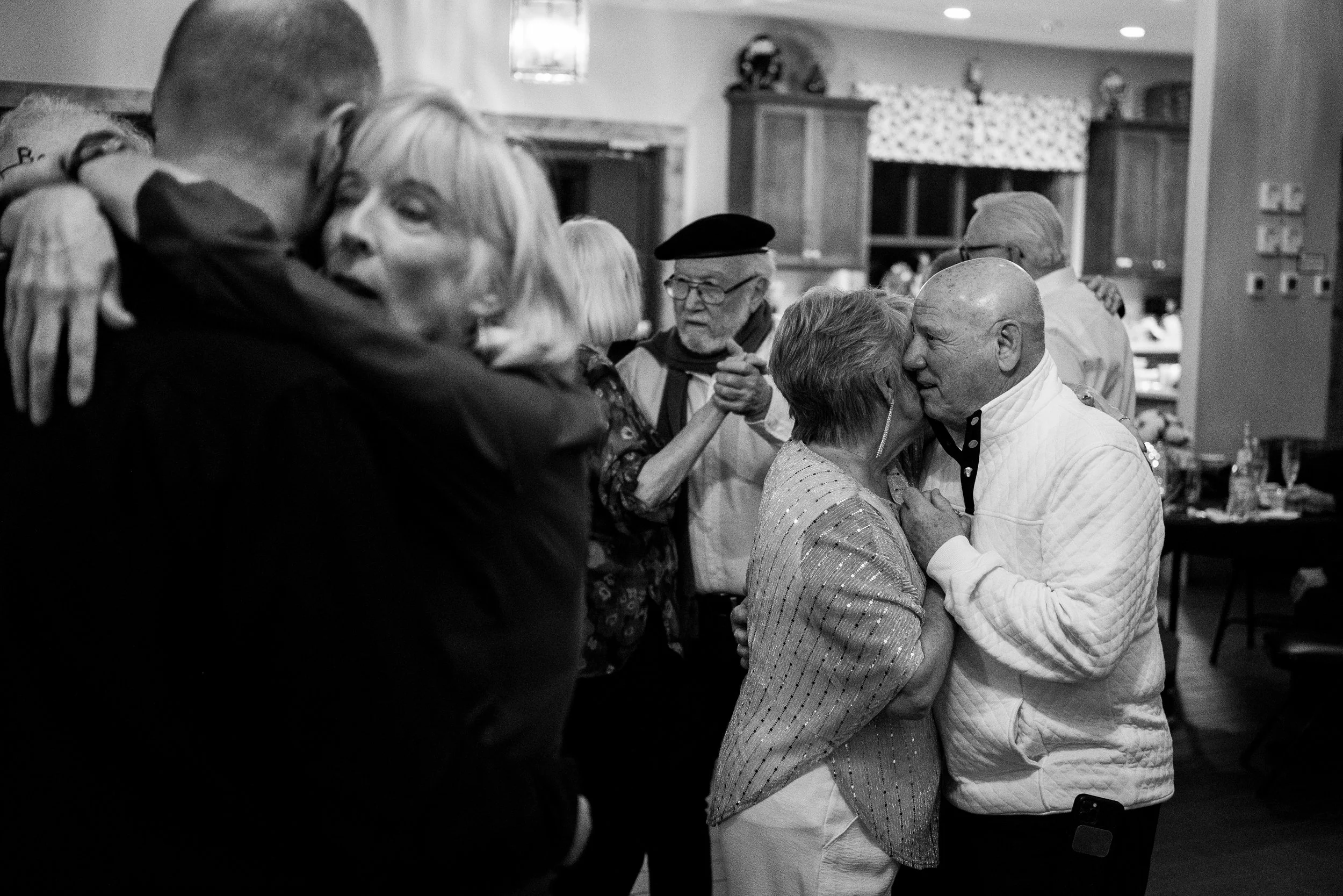 elderly couples dancing at a party
