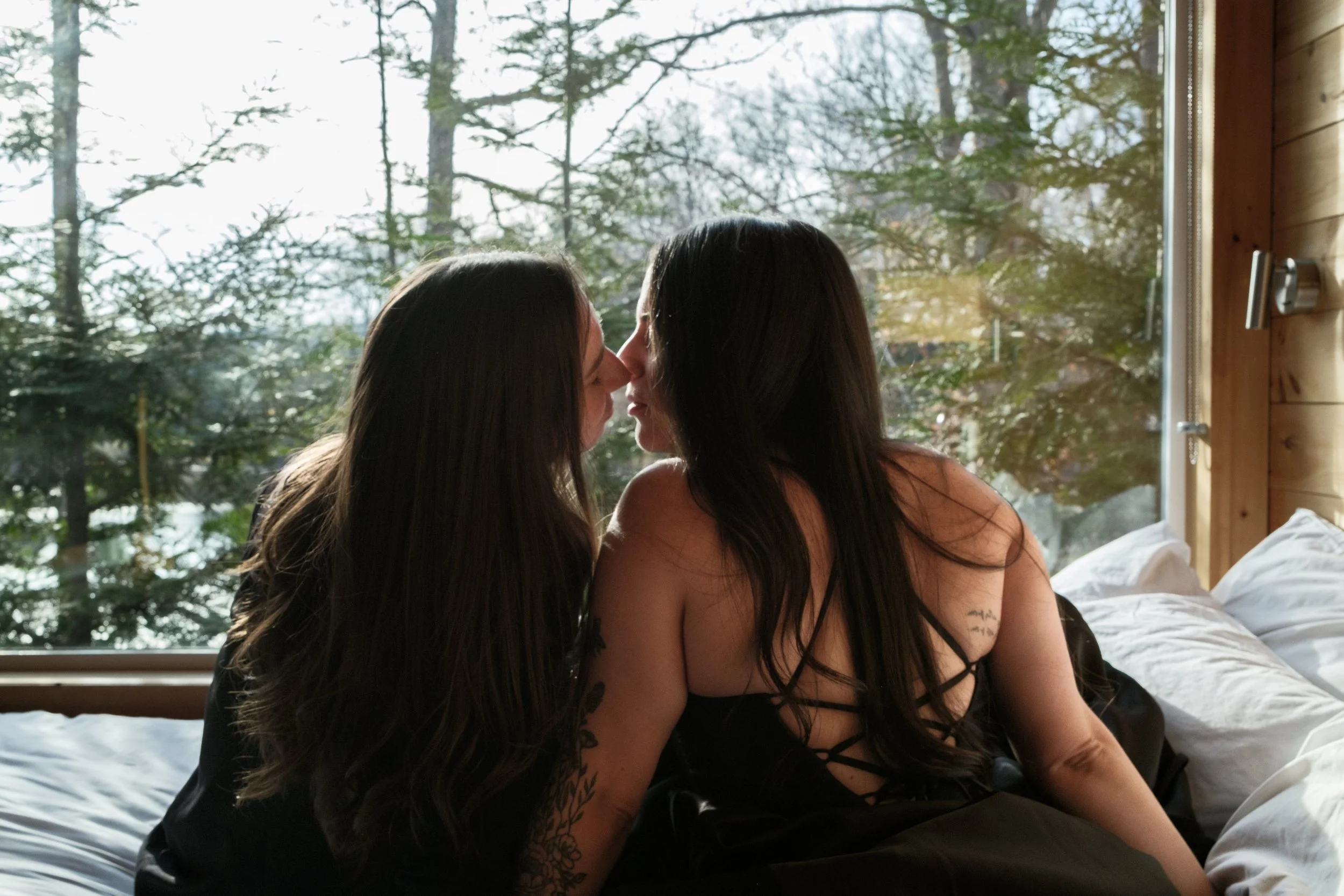 Gay woman couple kissing after getting married at Alexander Homestead in Charlotte