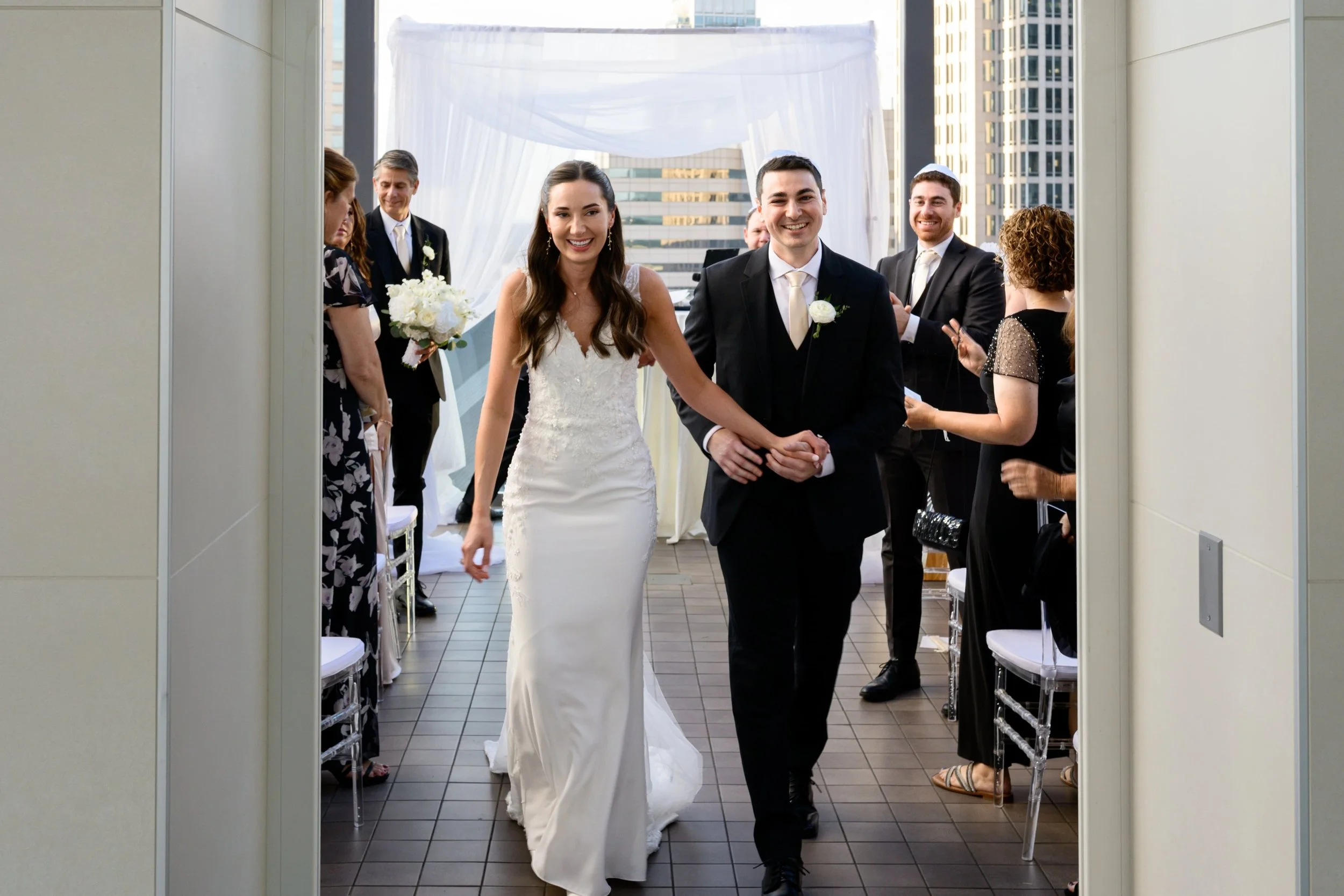 Bride and groom just married at Nuvole Rooftop TwentyTwo walking down the isle