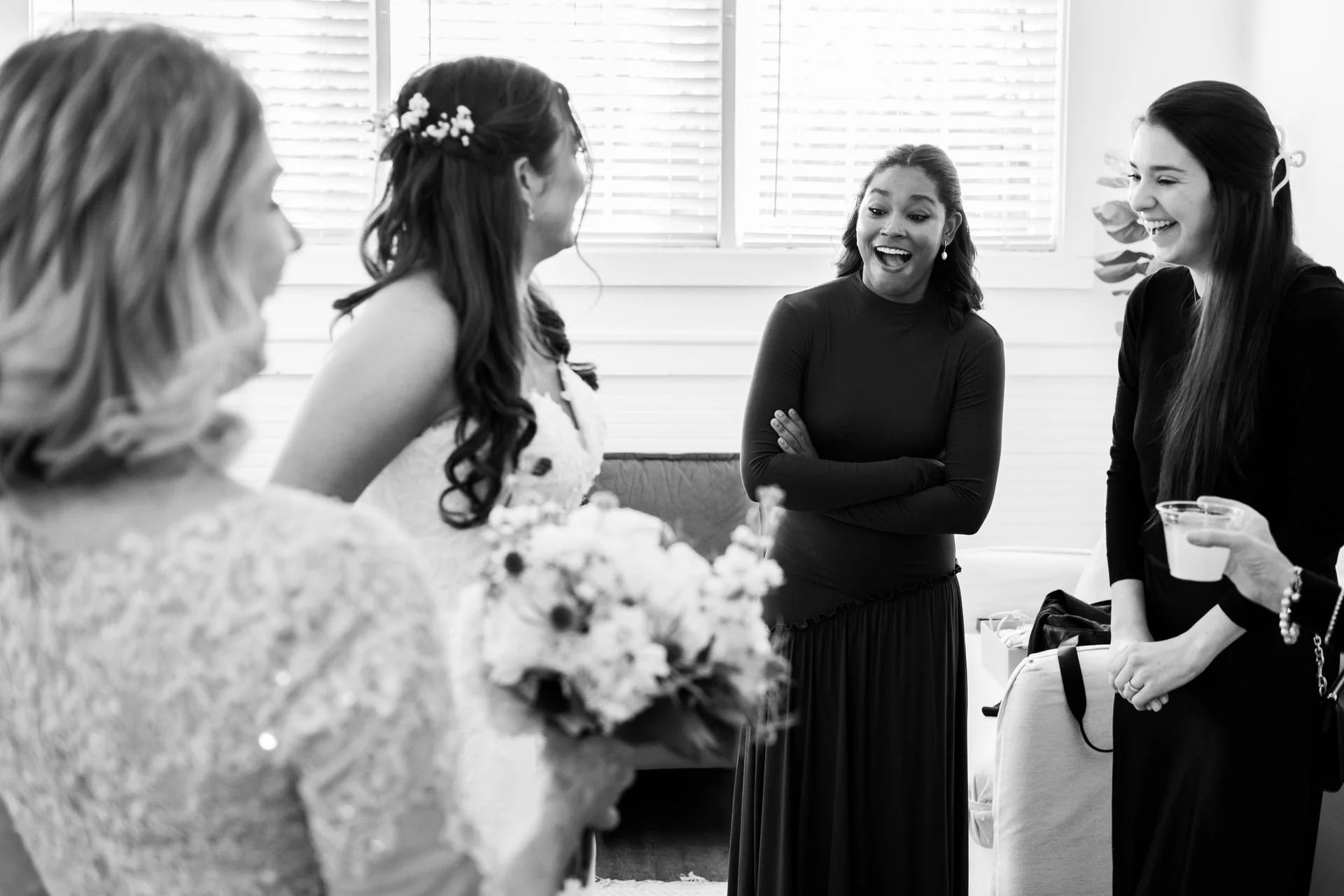 bridal party sharing a laugh in dressing room of Founders Dairy Barn by Brandon Pickett Photography