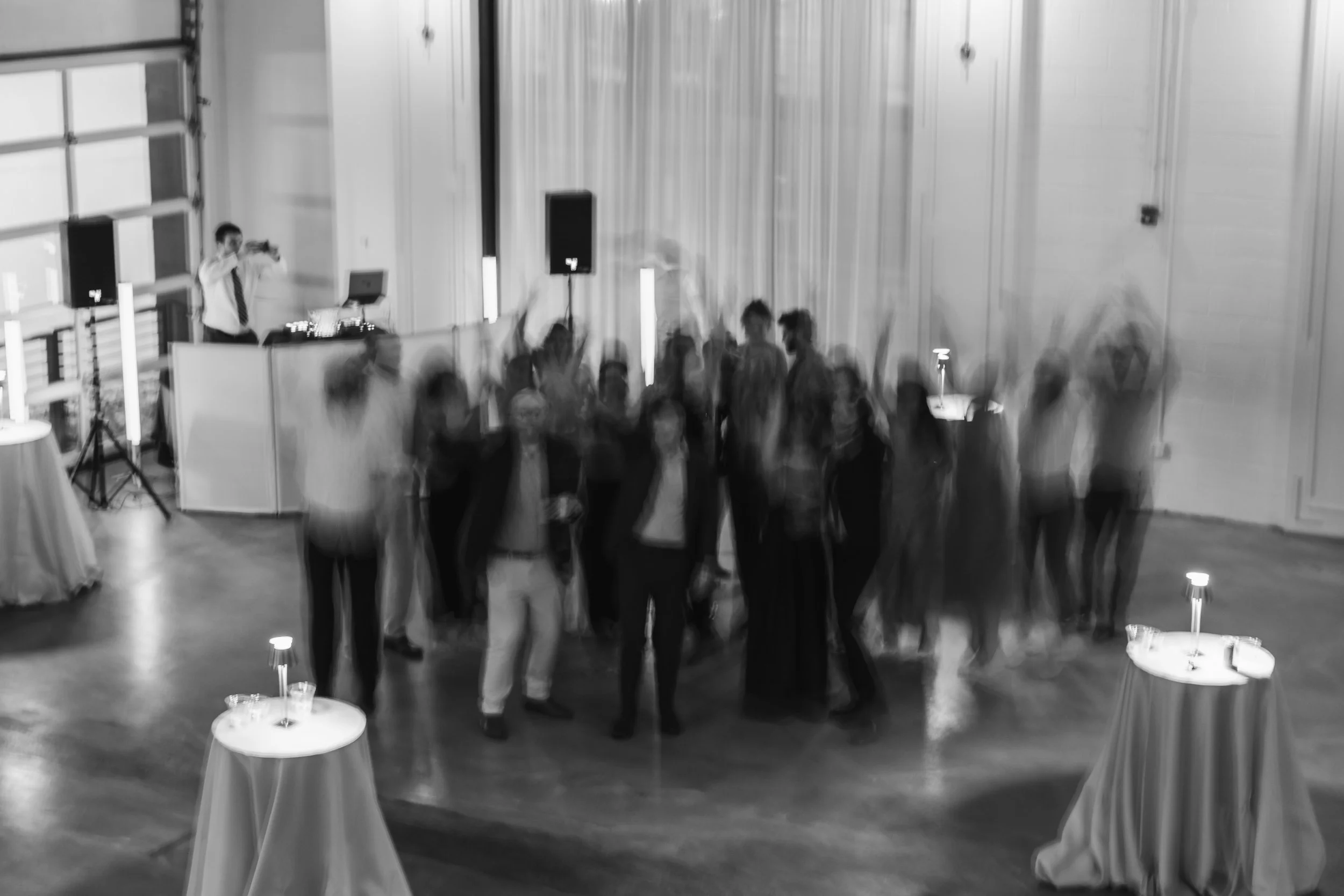Blurry group shot made with a long exposure on the dance floor at a wedding reception in Charlotte, NC.